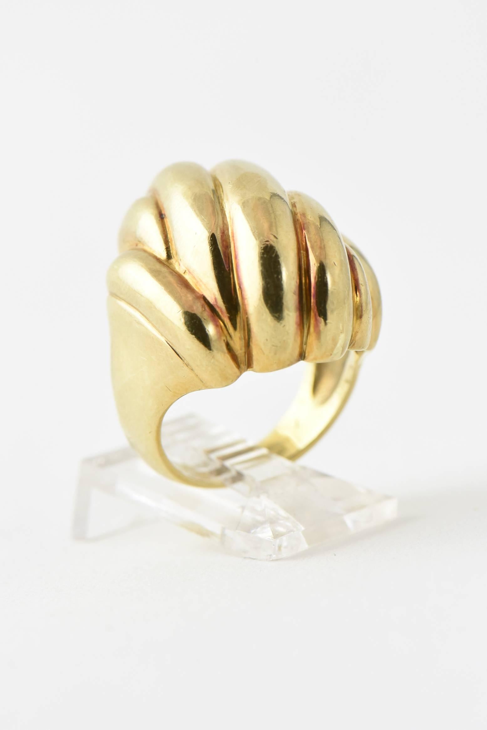 Highly stylized 3 dimensional ribbed design 14k yellow gold ring.

This ring was sized so the mark is no longer there.  The person it came from bought most of her jewelry at Neiman Marcus.

US size 5.75

It tests 14k.