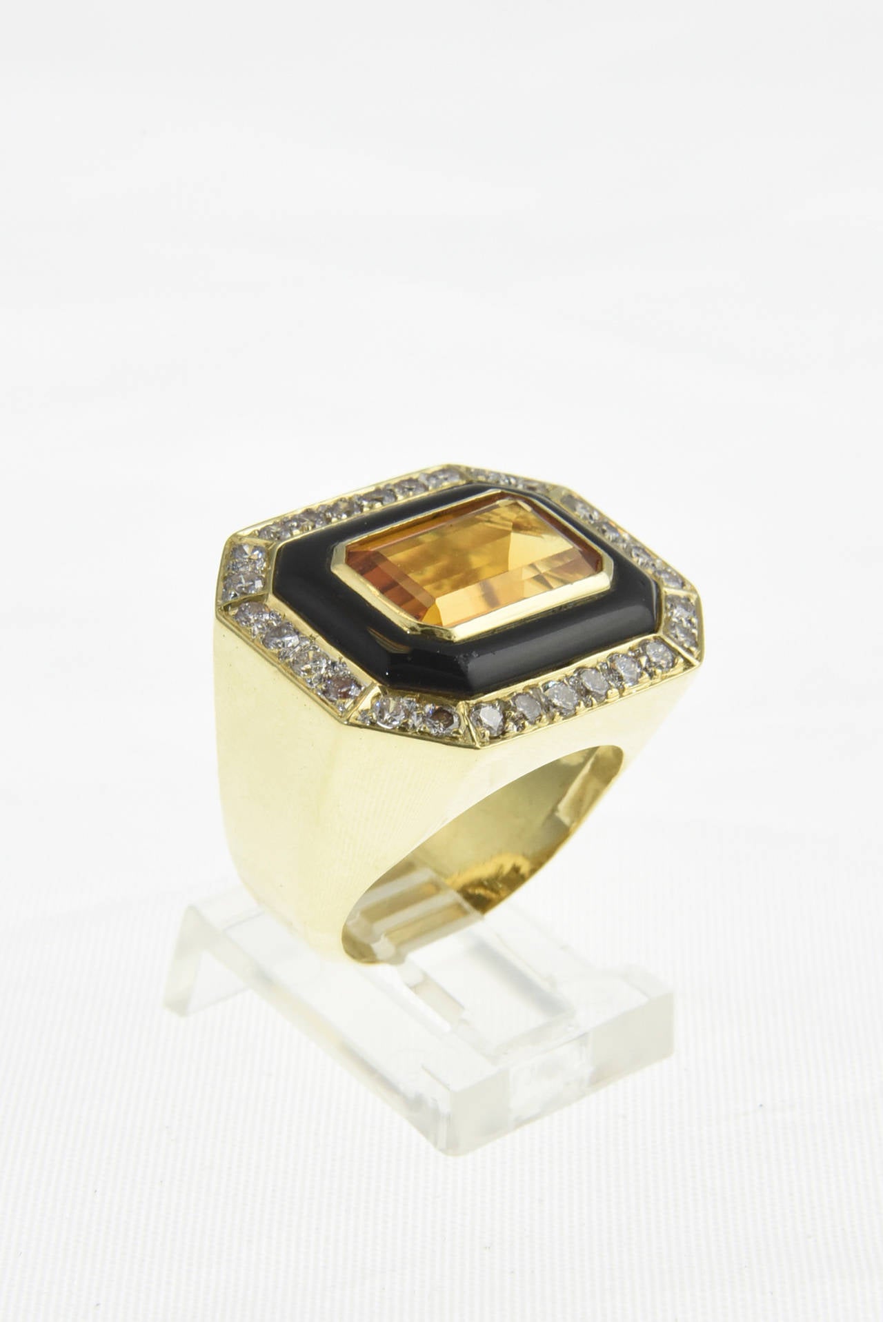 Dramatic Ring with citrine set in a black onyx frame which is set in a diamond and 18k gold octagonal frame

 US size 6 1/4