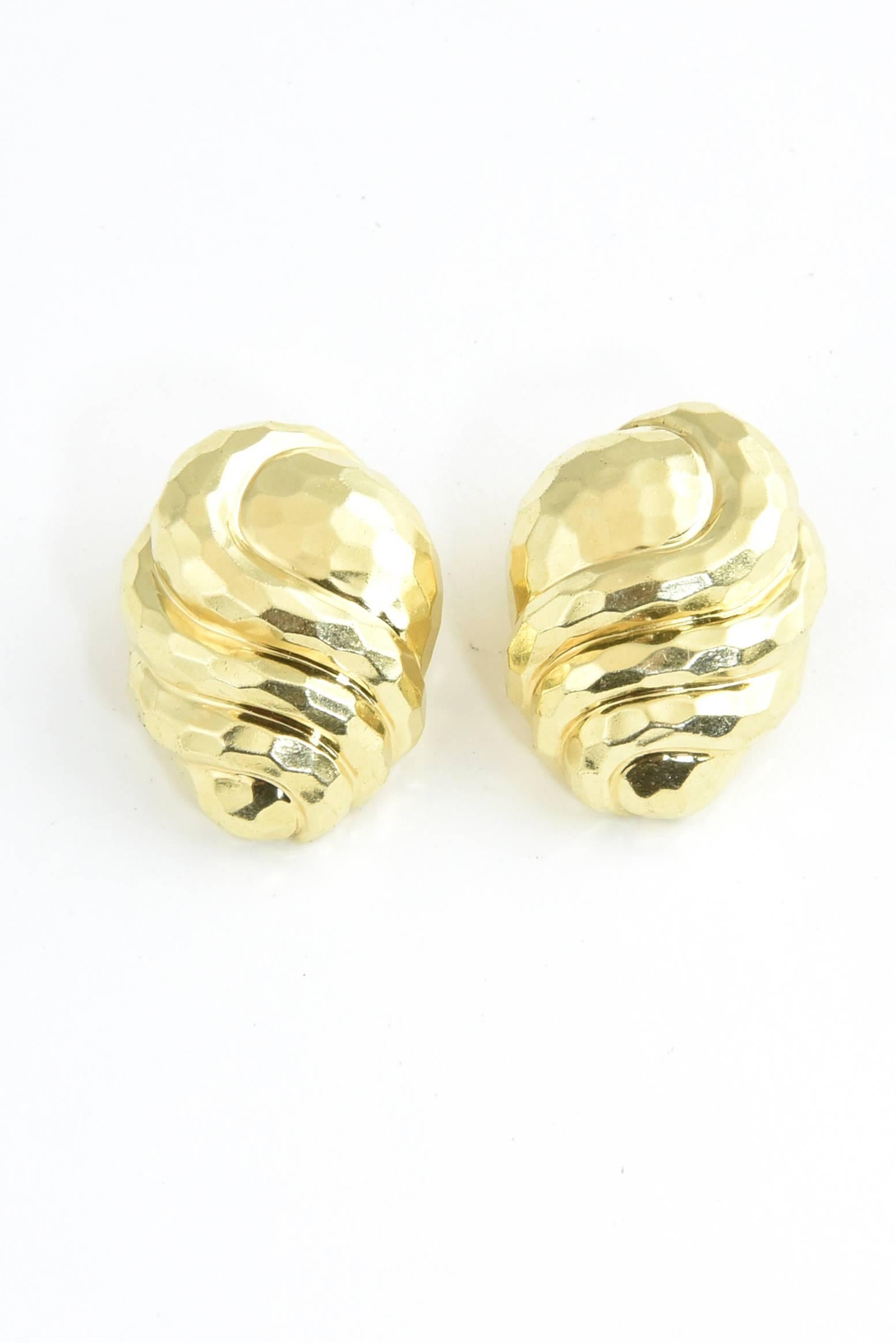 Finely made Henry Dunay hammered 18k gold earrings featuring a gold swirl over a teardrop.  These earrings are 18k yellow gold and have clips on the backs (no posts).