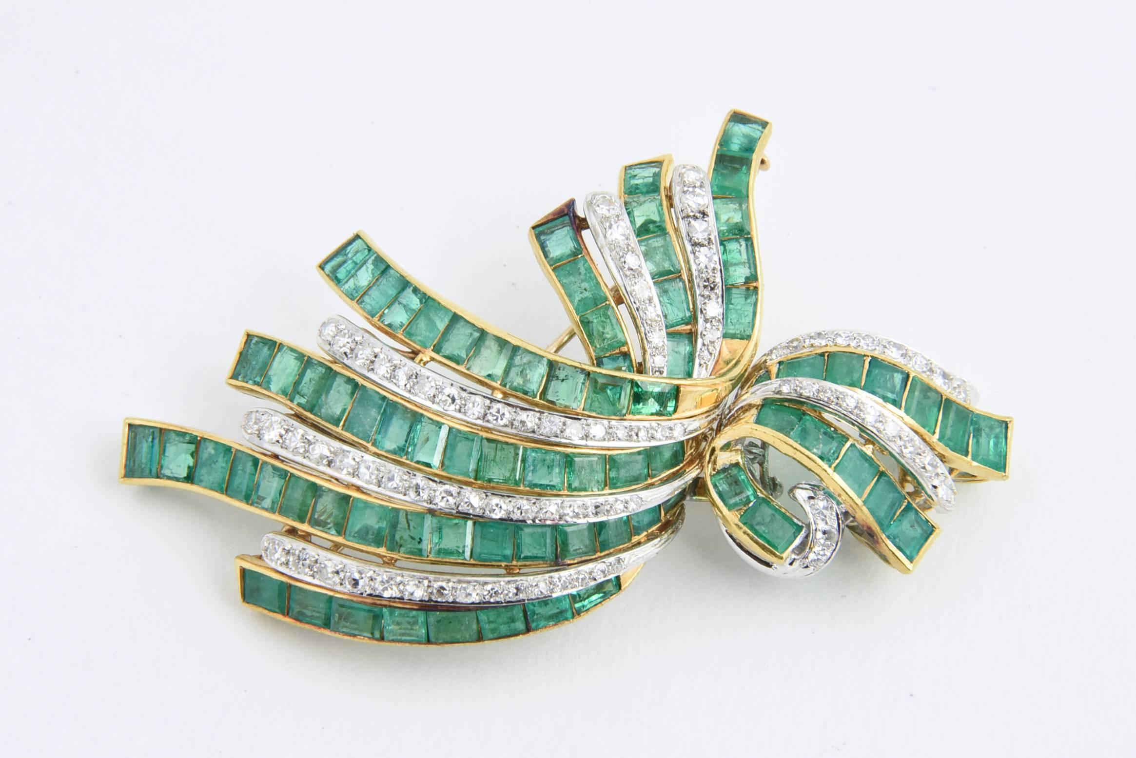 Impressive diamond and emerald brooch and earring mounted in 22k gold.

Earrings measure 1.14 x .62- they have posts
Brooch measure 2.75 x 1.5 