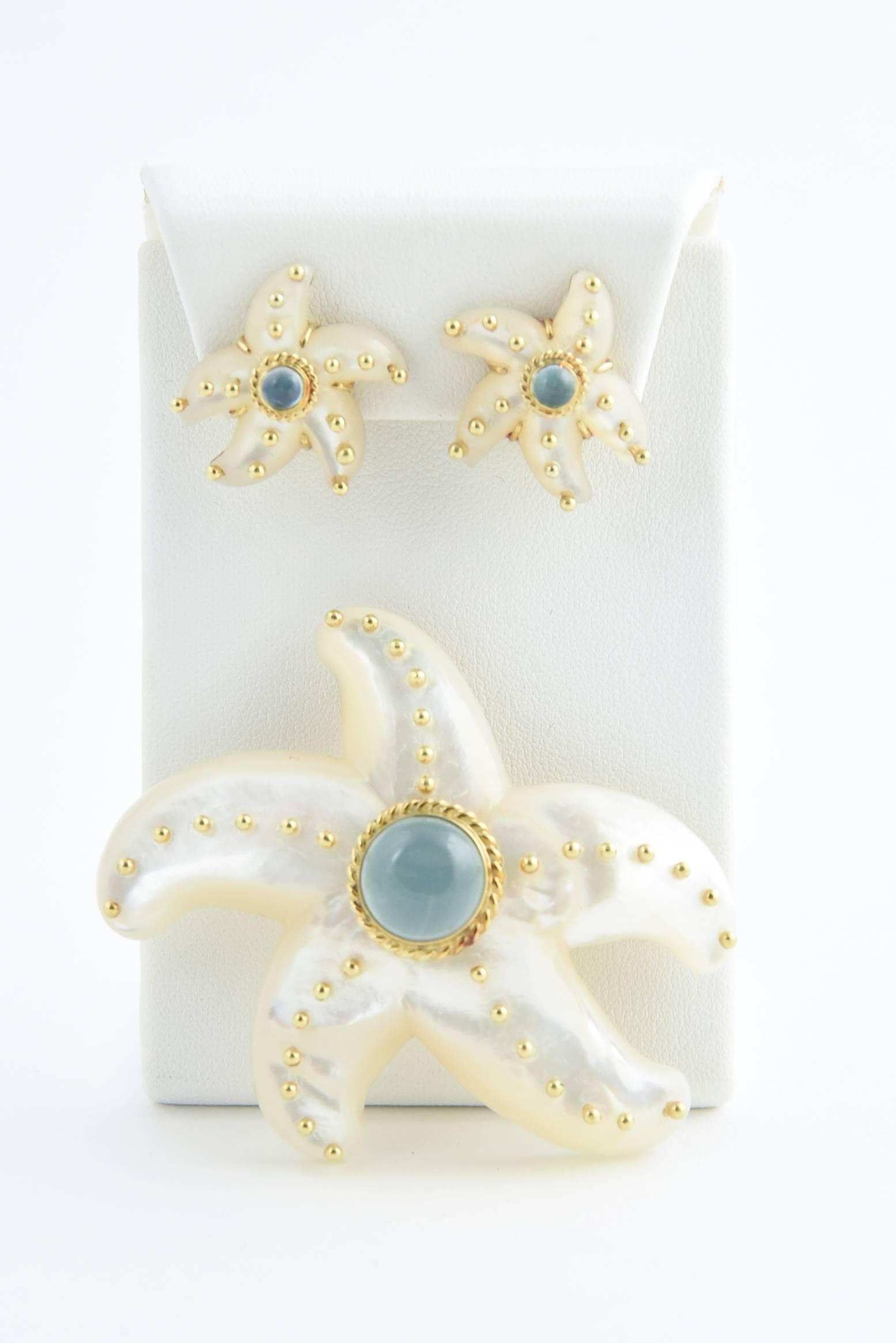 Refreshing reminder of the sea brooch pendant and matching earrings by MAZ of Italy.  Mother of Pearl starfishes with 14k yellow gold and blue tourmaline accents.

Brooch / Pendant 2.5 Length X 2 Width X  .65 depth
Below is the earring
