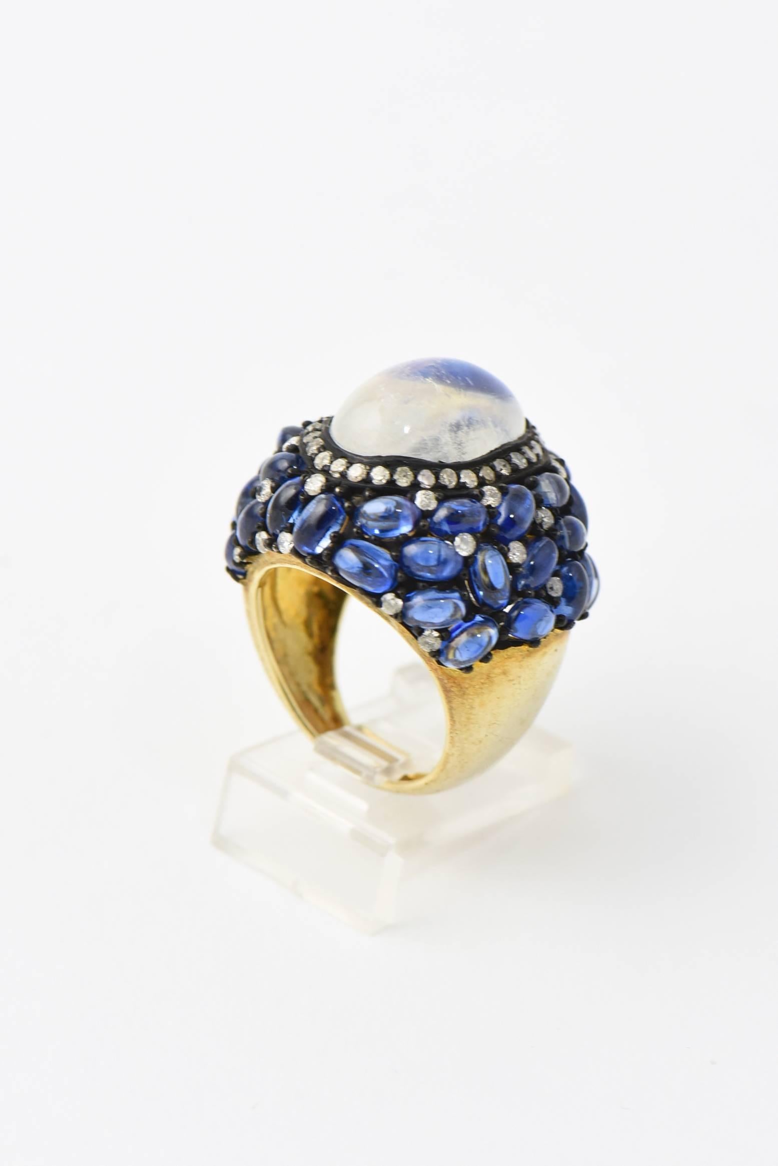 Dome shaped Moonstone, Kyanite and Diamond statement cocktail ring mounted in Vermeil Sterling Silver with an 18k inner band
US size 7
