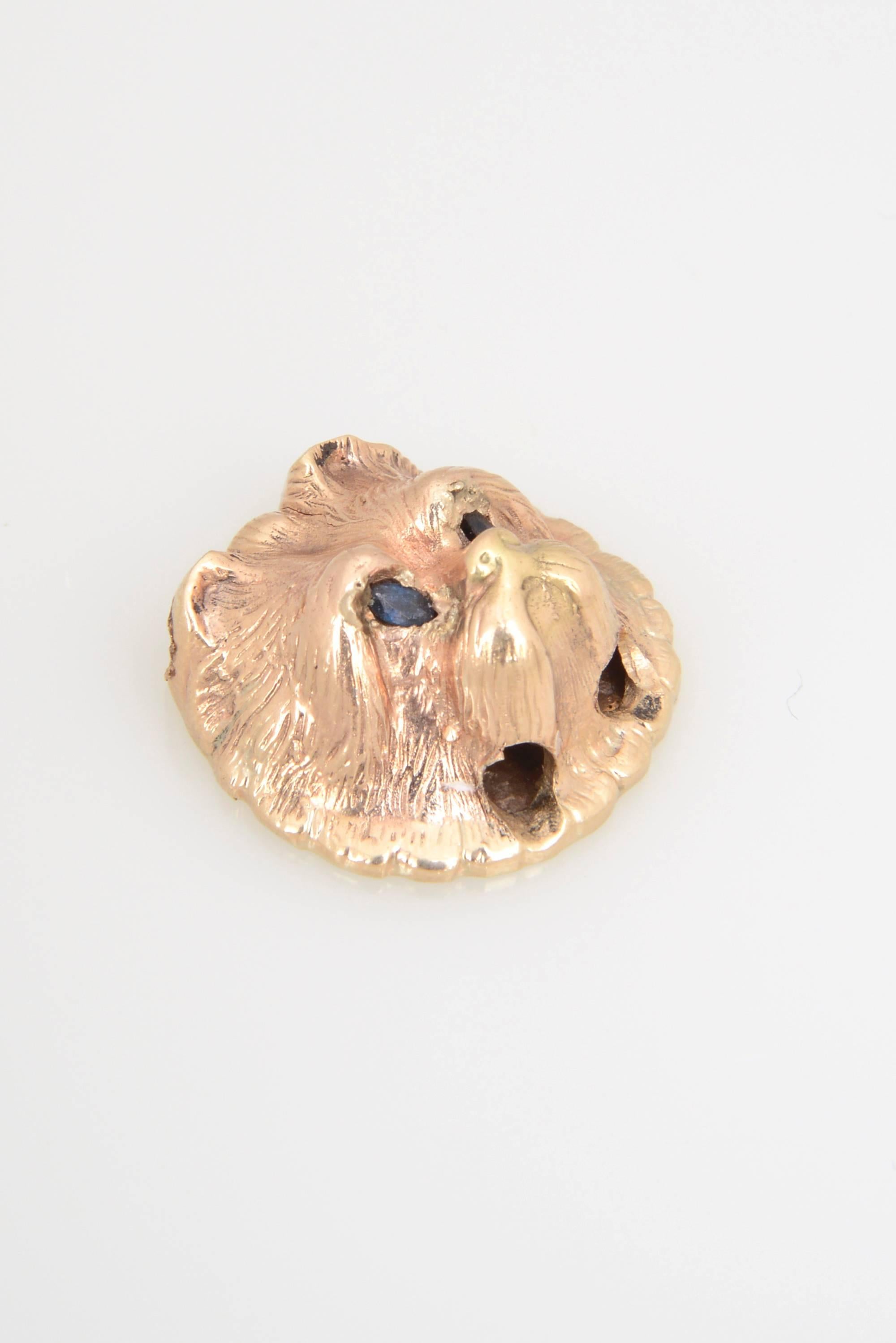 Adorable Victorian 14K yellow gold dog's head slide with sapphire eyes perfect for a chain or slide bracelet.  I believe this cute little guy is a yorkie or maltese.