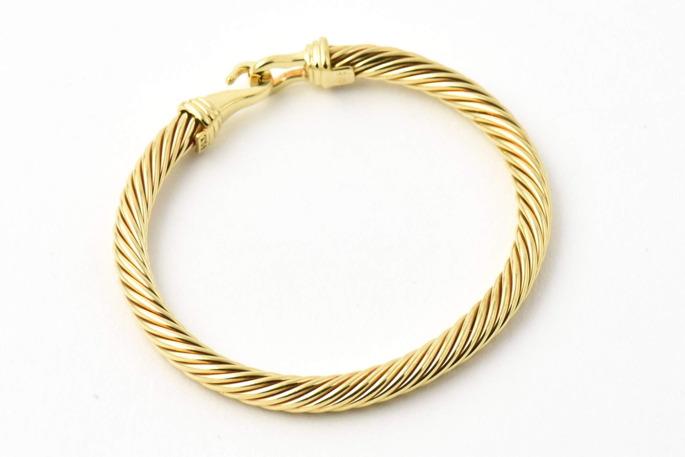 5mm Size David Yurman Cable Hook & Buckle 18k Bangle Bracelet
6.18 interior circumference 
Marked DY 18k

This model is currently on Yurman's site - the information is below:
Cable Classic Buckle Bracelet in 18K Gold, 5mm
$3,300
18-karat