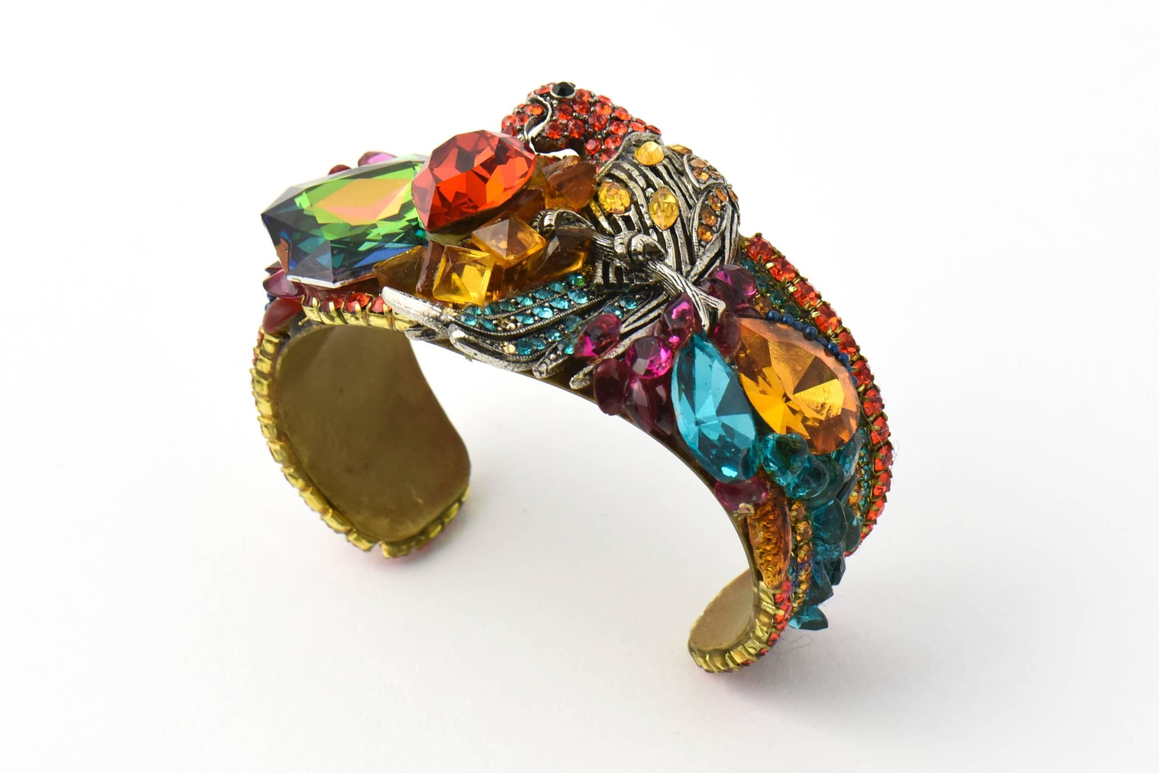 Impressive Wendy Gell Cuff Bracelet handmade by Gell in 1981.  This bold, colorful, and gorgeous bracelet features a parrot, paved with colorful Swarovski stones, accented with larger and smaller rhinestone which include a red heart and a large