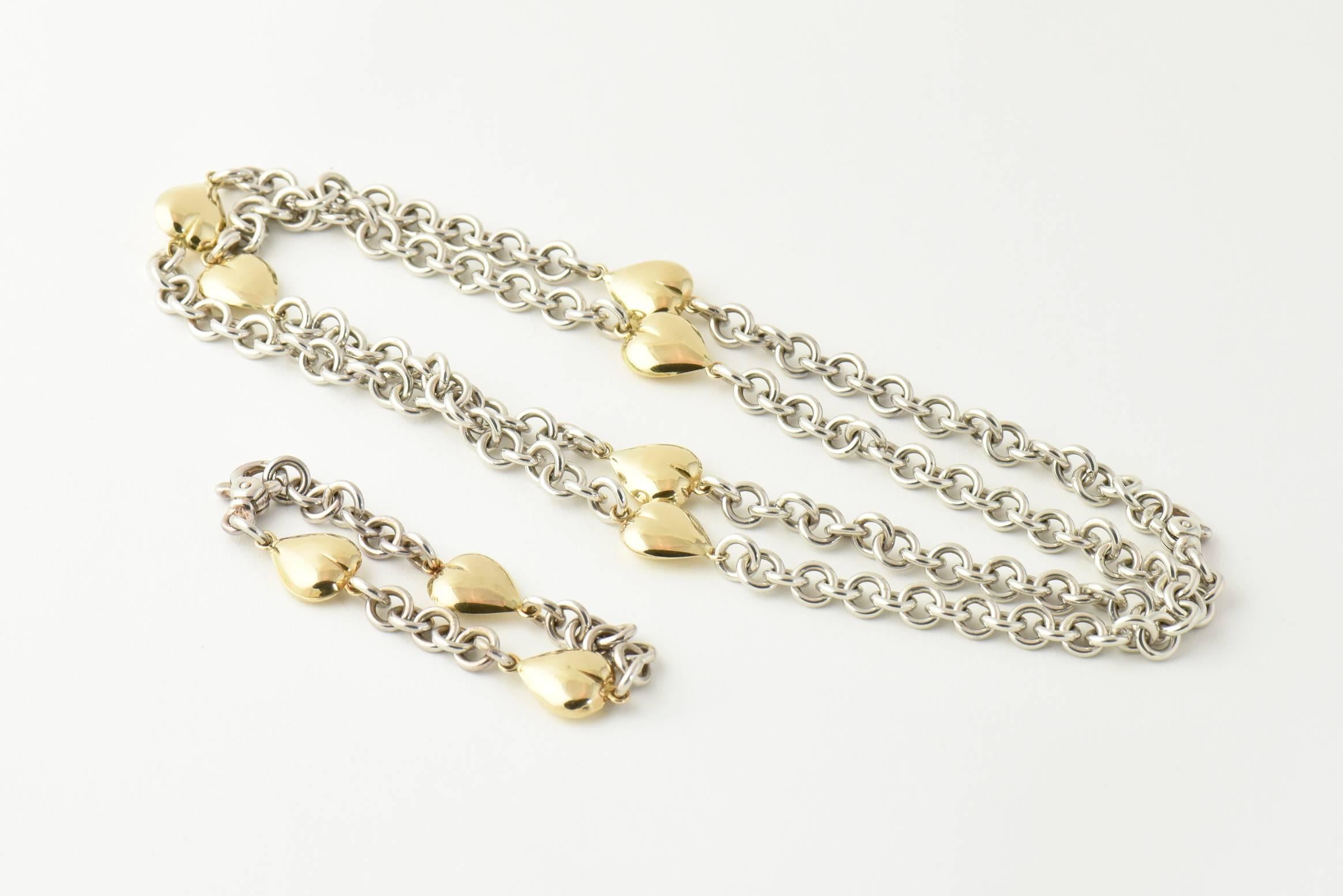 
Fabulous Gucci Heart Suite - a perfect gift for the one you love. The set features a necklace and matching bracelet.  Details for each are listed below.

Gucci sterling silver and 18K yellow gold necklace featuring 18K  gold hearts spaced between