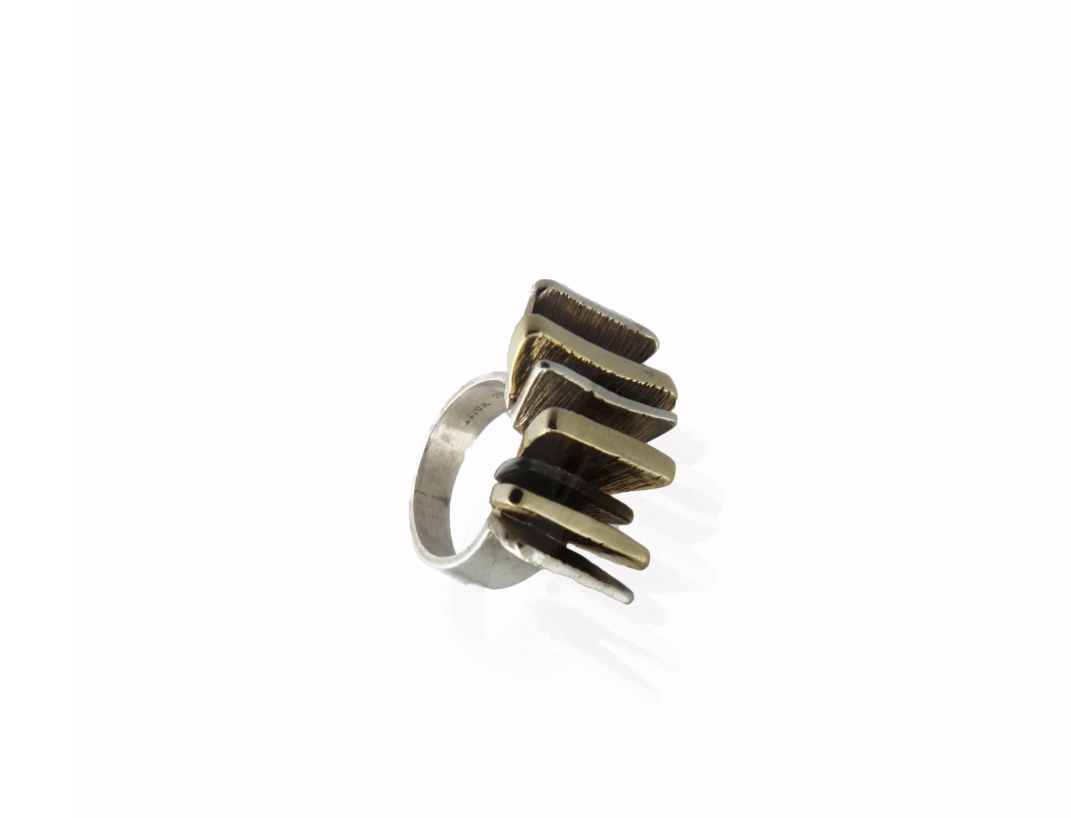 Mid-Century Modern Brutalist-style ring with sterling silver band featuring alternating rows of sterling silver and 14K yellow gold. US ring size: 5.5; sizable.
