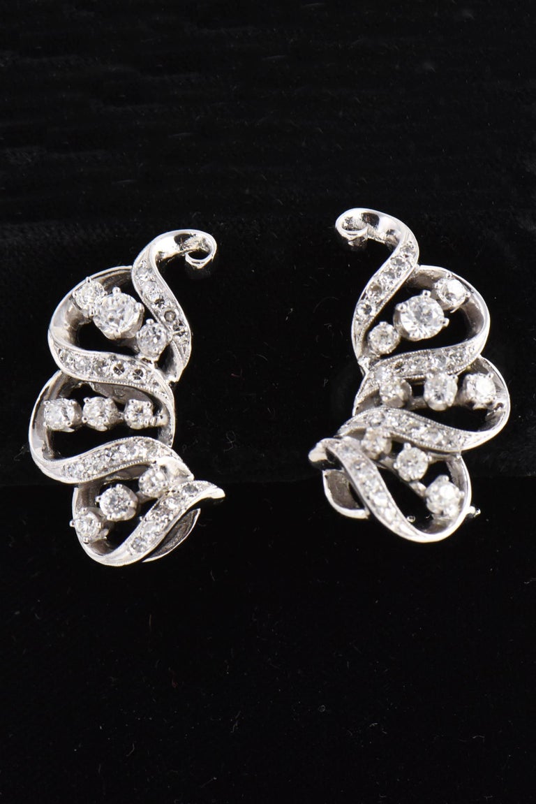 1950s Diamond Ribbon Swirl Platinum Cocktail Earrings For Sale at 1stDibs