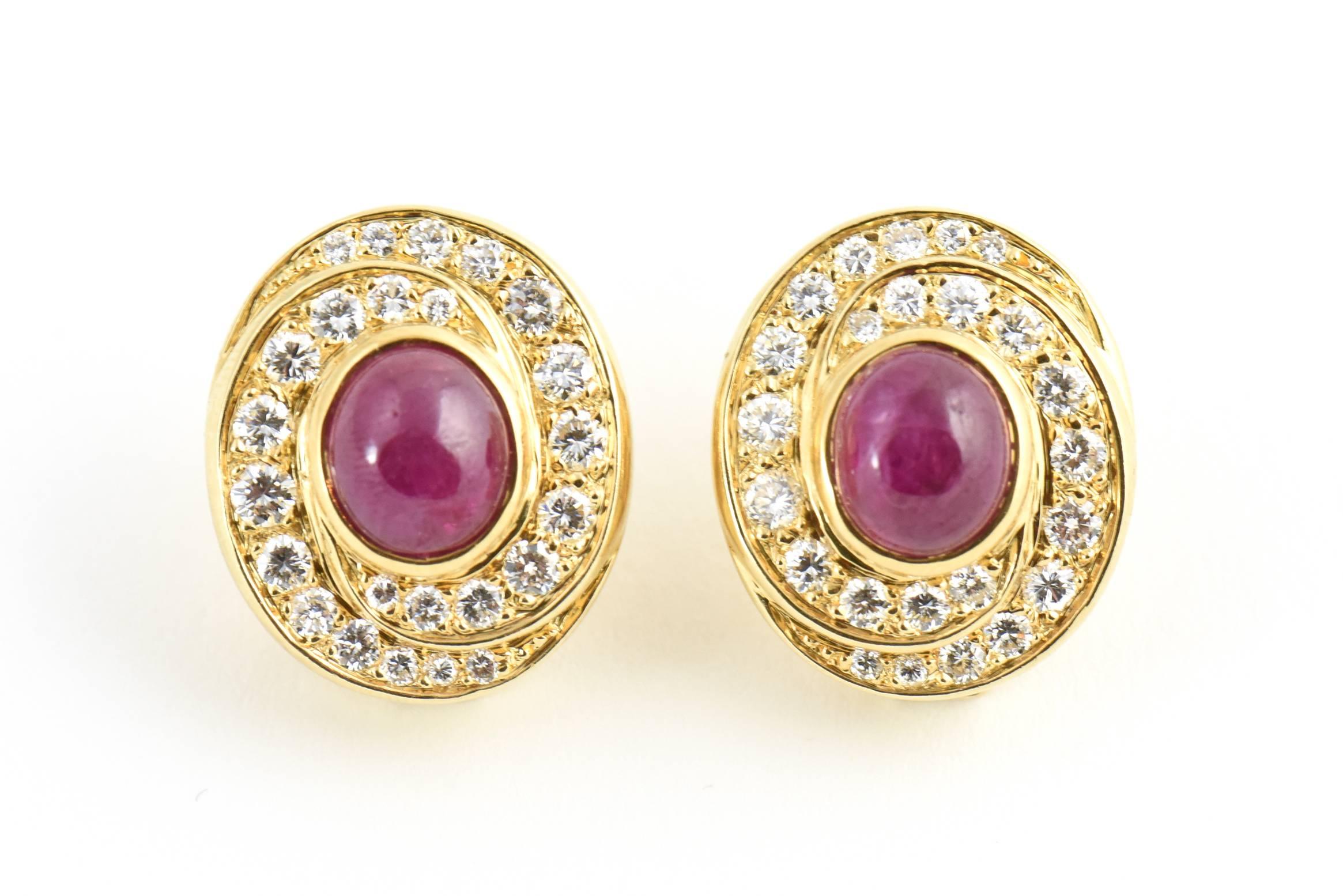 Pave diamonds swirl around a 5c Burma ruby in each of these earrings set in 18k yellow gold.  They have a clip back with NO post.

Marked 18k