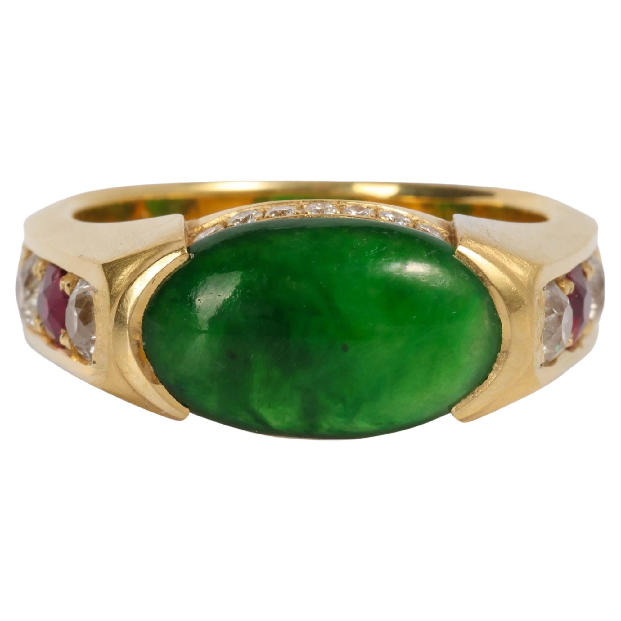 I commissioned this ring myself, using a gorgeous old-mine natural and untreated jadeite jade cabochon with the most amazing color and the worst setting. I also included old Burma rubies and hand-cut diamonds. 

This custom, handmade jade ring