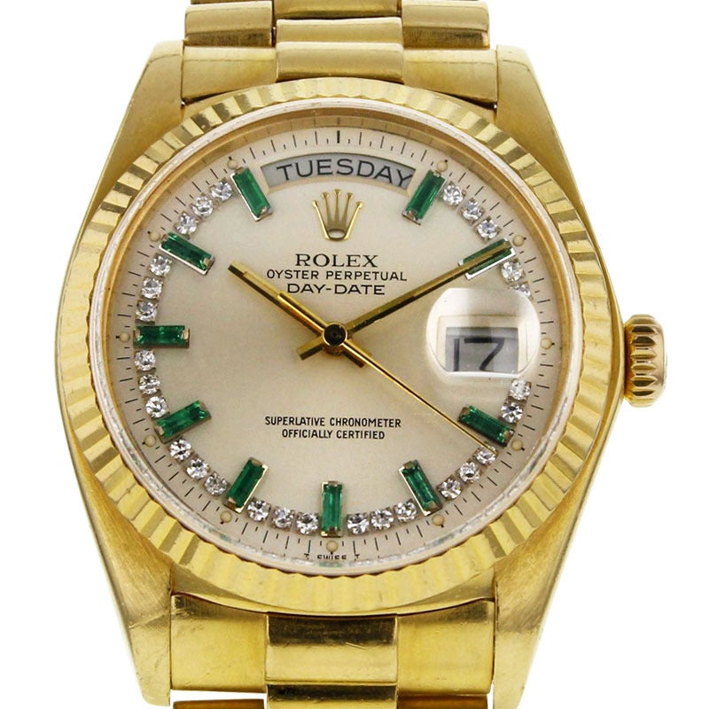 Exceptional Rolex Day-Date in yellow gold made with a yellow gold president bracelet, with ten emerald indexes and twenty-eight diamond indexes. Ref 18038/6607311. Year 1981.