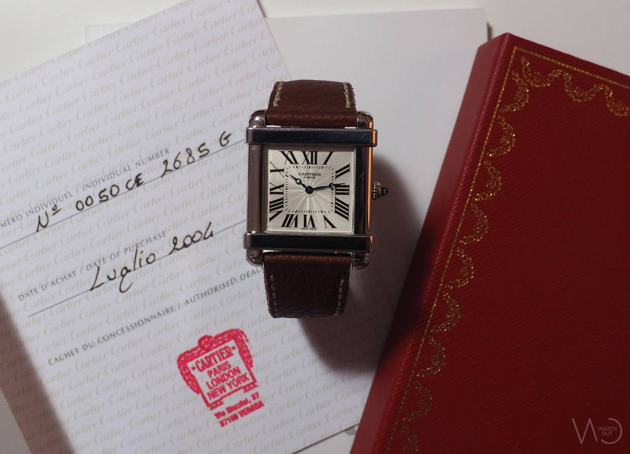 Cartier
Cartier Tank Chinoise
Ref. 2685G
Platinum Case
Silvered Guilloché Dial with Roman Numerals
18K White Gold Cartier Deployante
Manual Winding
Dimensions: 29 x 29 mm
Year: 2004

Accompanied by Guarantee Dated 2004, Instructions and