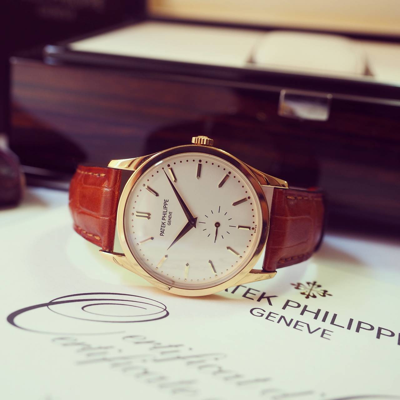 Patek Philippe
Patek Philippe Calatrava 
Ref. 5196J
18K Yellow Gold Case
Silvered Dial with Baton Indexes and Dauphin Hands
Subsidiary Seconds
18K Yellow Gold Deployante by Patek Philippe (including original buckle)
Manual Winding
Sapphire