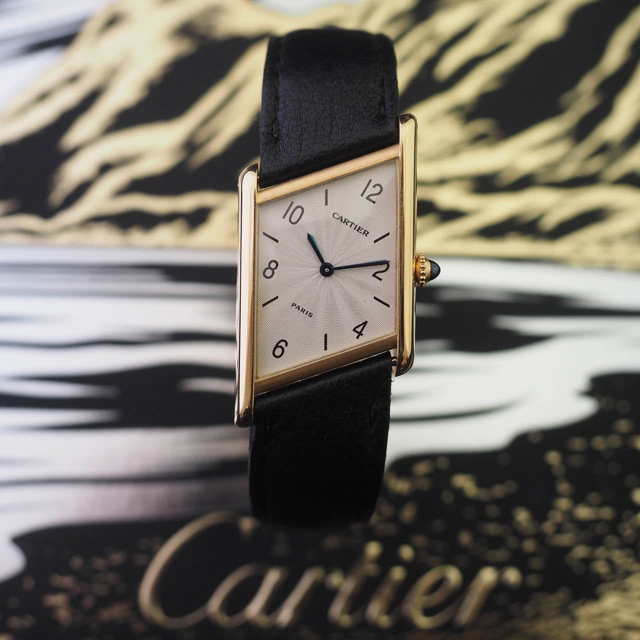 Cartier
Cartier Tank Asymetrique
Limited Edition n° 248/300
18K Yellow Gold Case
Guilloche Dial with Arabic Numbers
18K Yellow Gold Original Cartier Deployante
Manual Winding
Dim.: 23 x 32 mm
Year: 1996