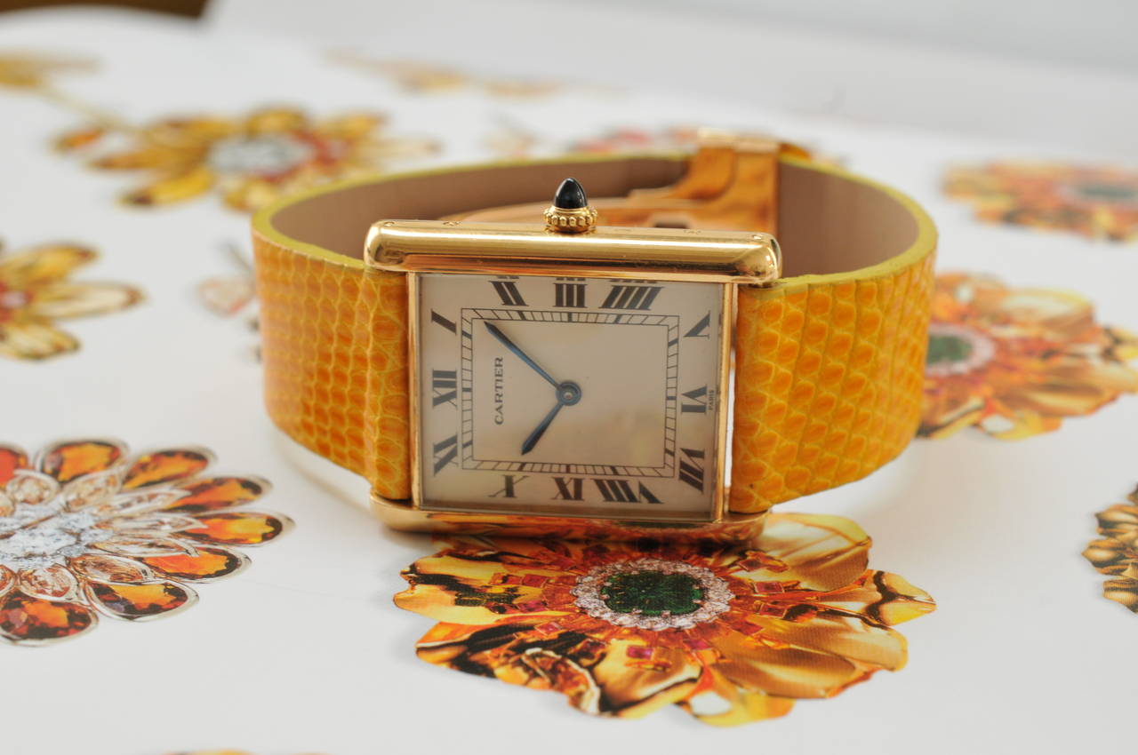 Cartier
Cartier Tank Jumbo
18K Yellow Gold Case
White Dial
18K Yellow Gold Original Cartier Deployante 
Automatic Winding
Dimensions: 35mm x 28mm
Year: 1970's