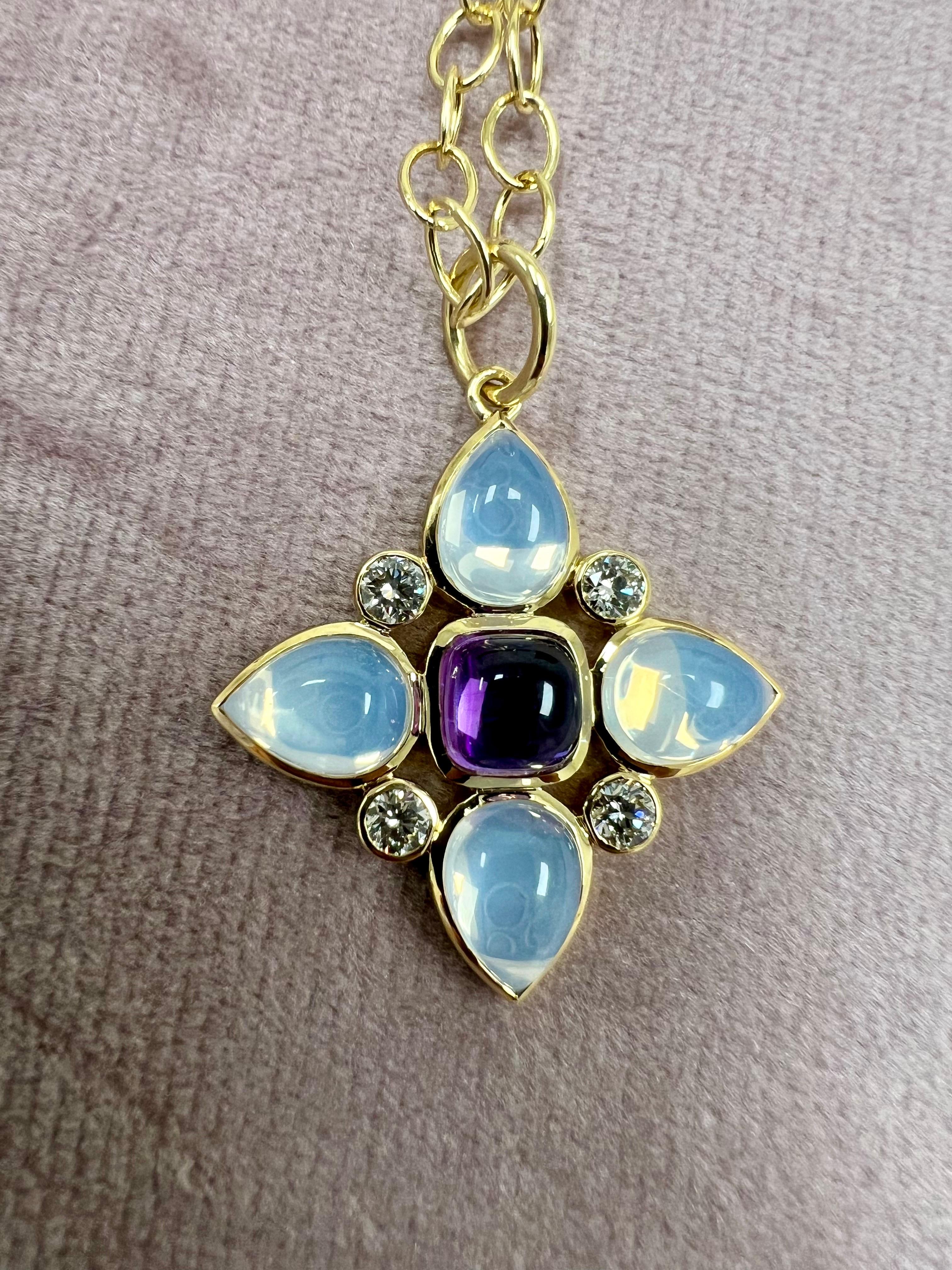Created in 18 karat yellow gold
Amethyst 1.50 carats approx.
Moon Quartz 4.50 carats approx.
Diamonds 0.45 carat approx.
Chain sold separately

Enrobing 18 karat yellow gold, an amethyst of 1.50 carats, moon quartz of 4.50 carats, and Diamonds of