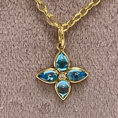 Syna Yellow Gold Blue Topaz Flower Pendant with Diamonds