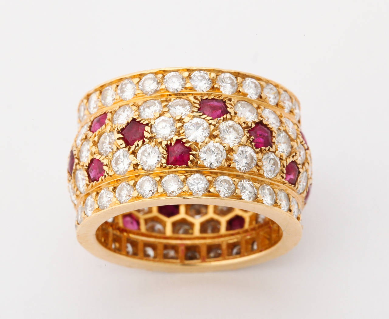18kt yellow gold, ruby and diamond (app. 6cts) ring from the iconic Panthère collection.  A perfect size 6, and a comfortable 1/2 inch in width, this ring is meant to be worn and enjoyed.  Fully signed, numbered and hallmarked.  Made in France.