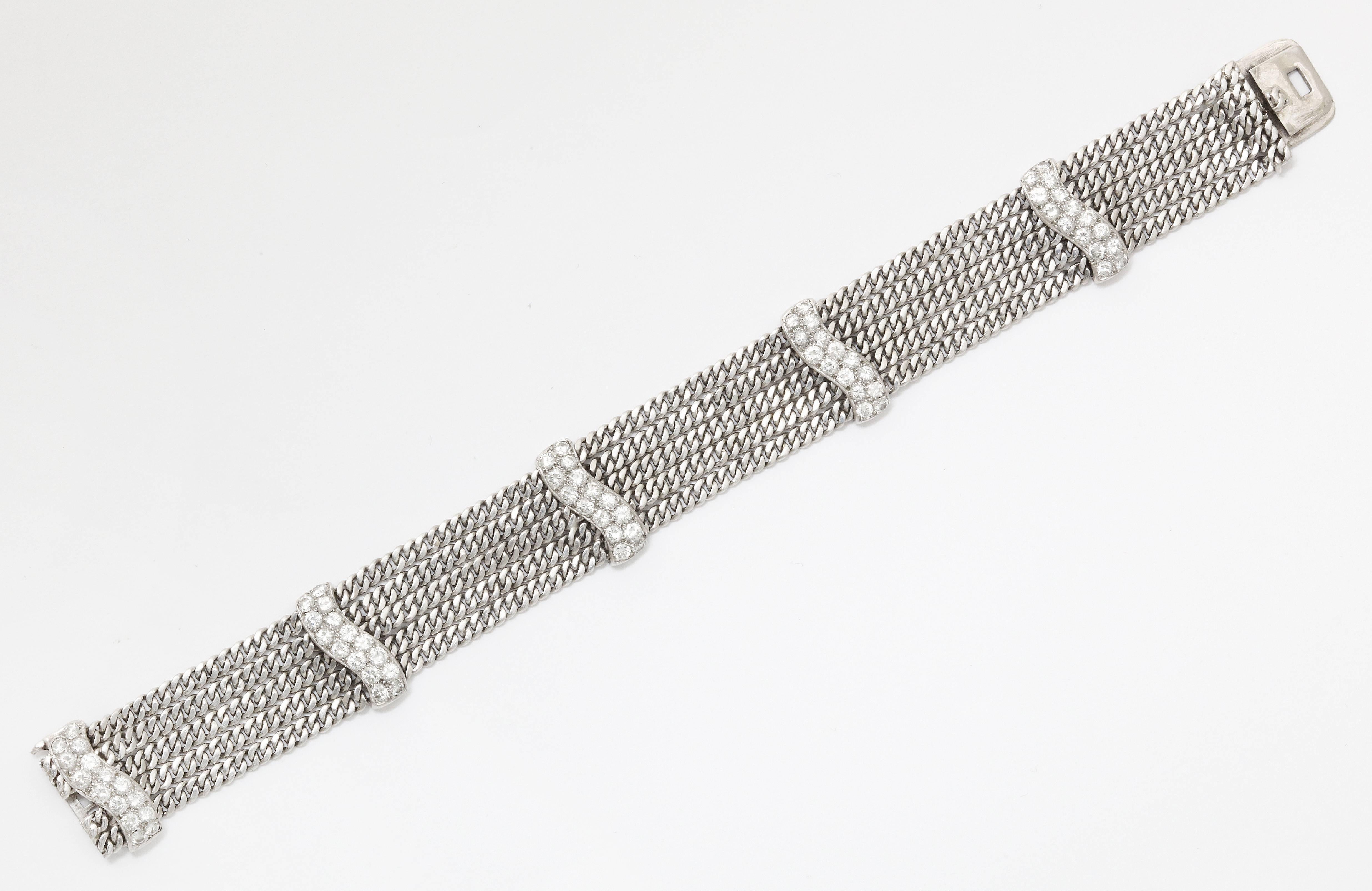 The beauty, and strength, of platinum shines through in this bold design.  Five curb link platinum chains are connected by pave set diamond (total weight app. 1.80cts) bars.  The subtle curves at the ends of the bars add just the right touch of