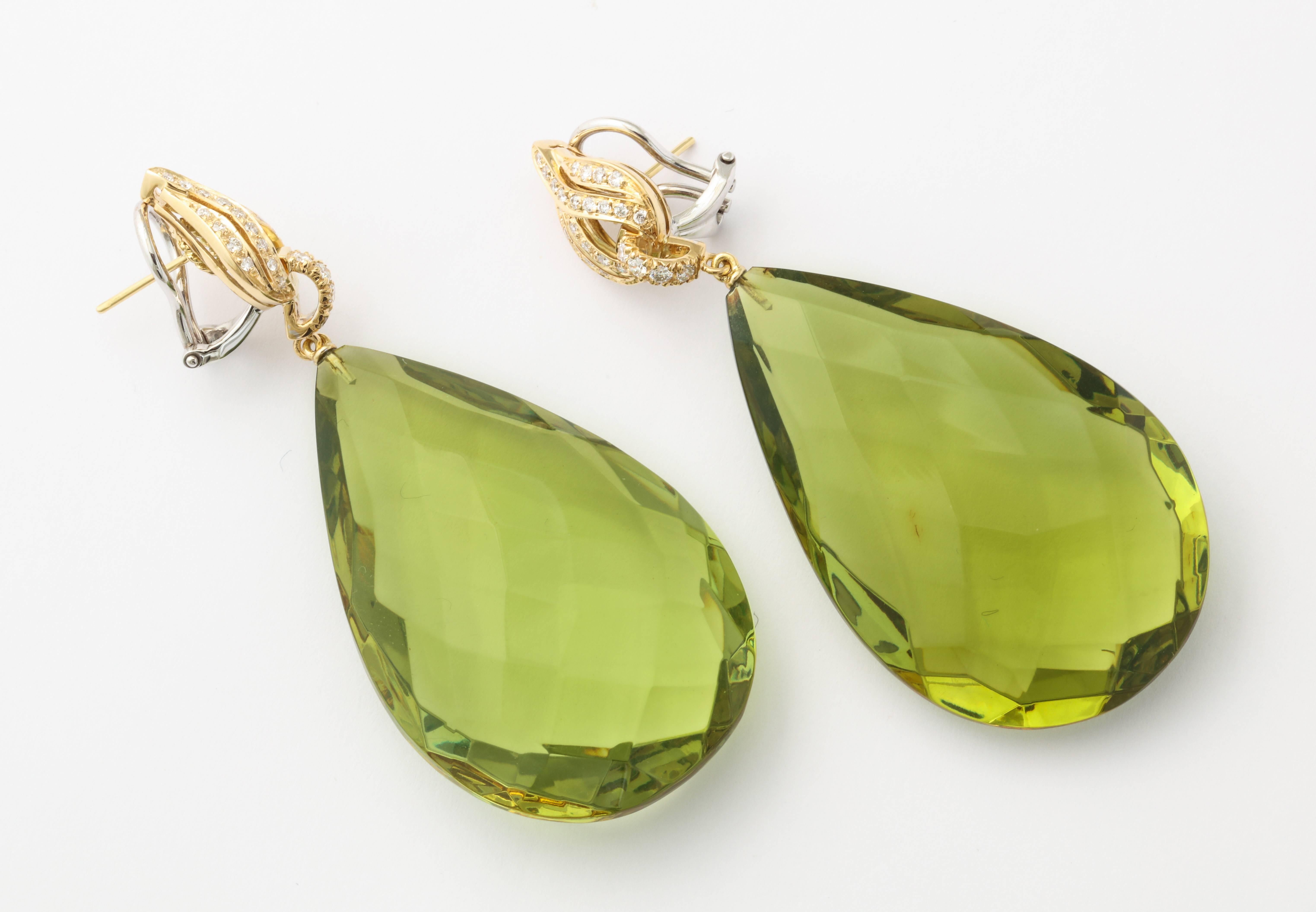 At a full two inches long and just over an inch wide, these spectacular earrings are true showstoppers.  The impressive size remains comfortable thanks to the clever use of amber for the drops.  As opposed to a stone which could have been used,