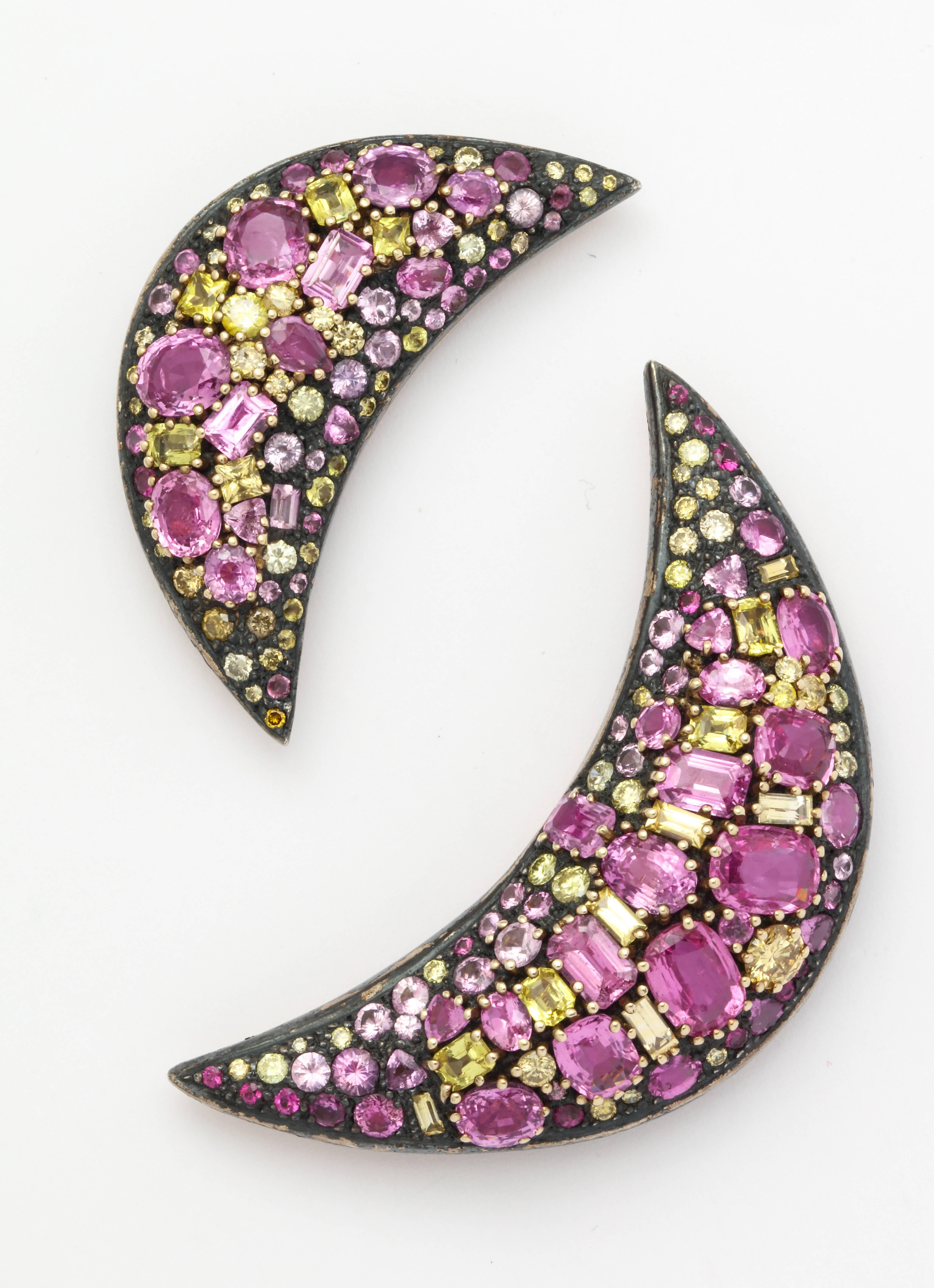 This very rare pair of brooches represents Cooperman's work at her absolute finest.  The design of the "Slice" pins is uniquely hers and every single one is completely one of a kind.  Stone by stone, each rendition comes to life in the