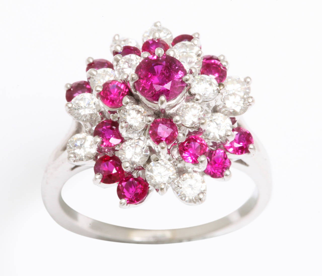 Bright red ruby and sparkling diamond cocktail ring.  The ring is very three dimensional and has great volume.  Comfortable to wear and a pleasure to see.
