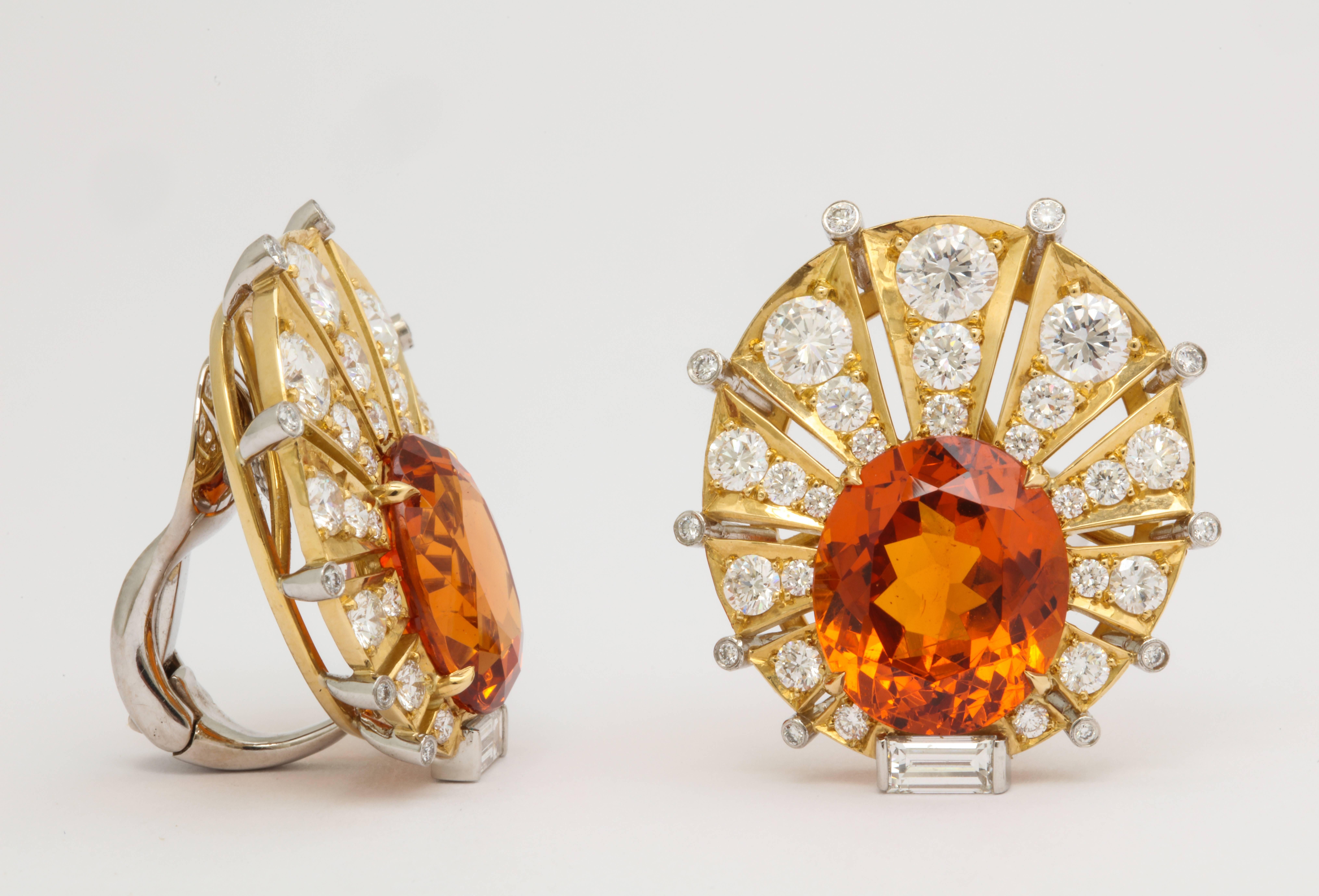 Already exceptionally rare on their own, a perfectly matched pair of mandarin garnets is almost unheard of.  These beautiful ovals weigh 10.44cts and 10.78cts making them that much more impressive for their size.  The bold look is expertly mounted