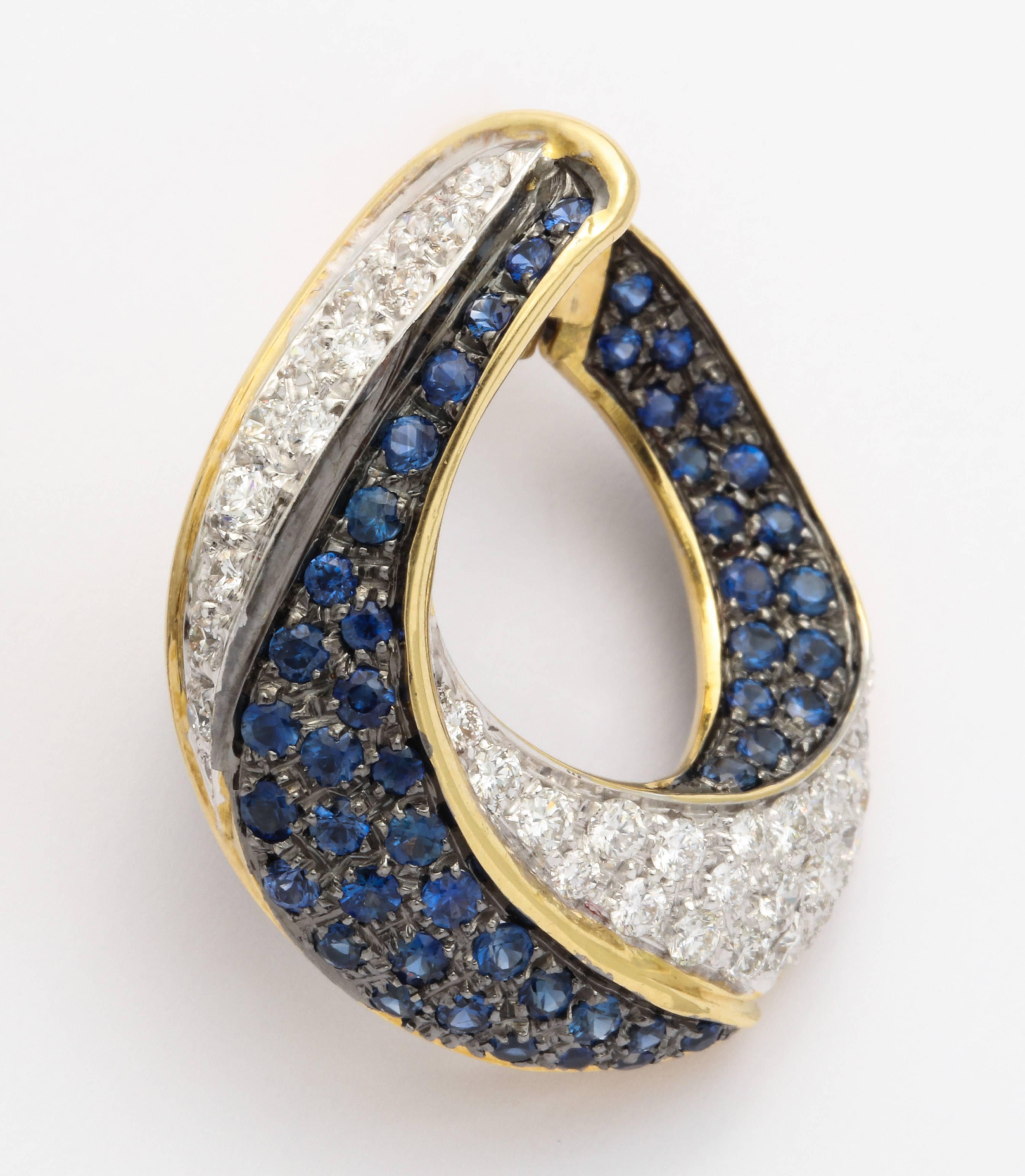 Sleek and stylish as only the Italians know how to do it, these earrings are sure to brighten up the day- or the evening.  The versatile design allows for these wonderful hoops to be worn casually or for a dressy affair.  The rich blue sapphires are
