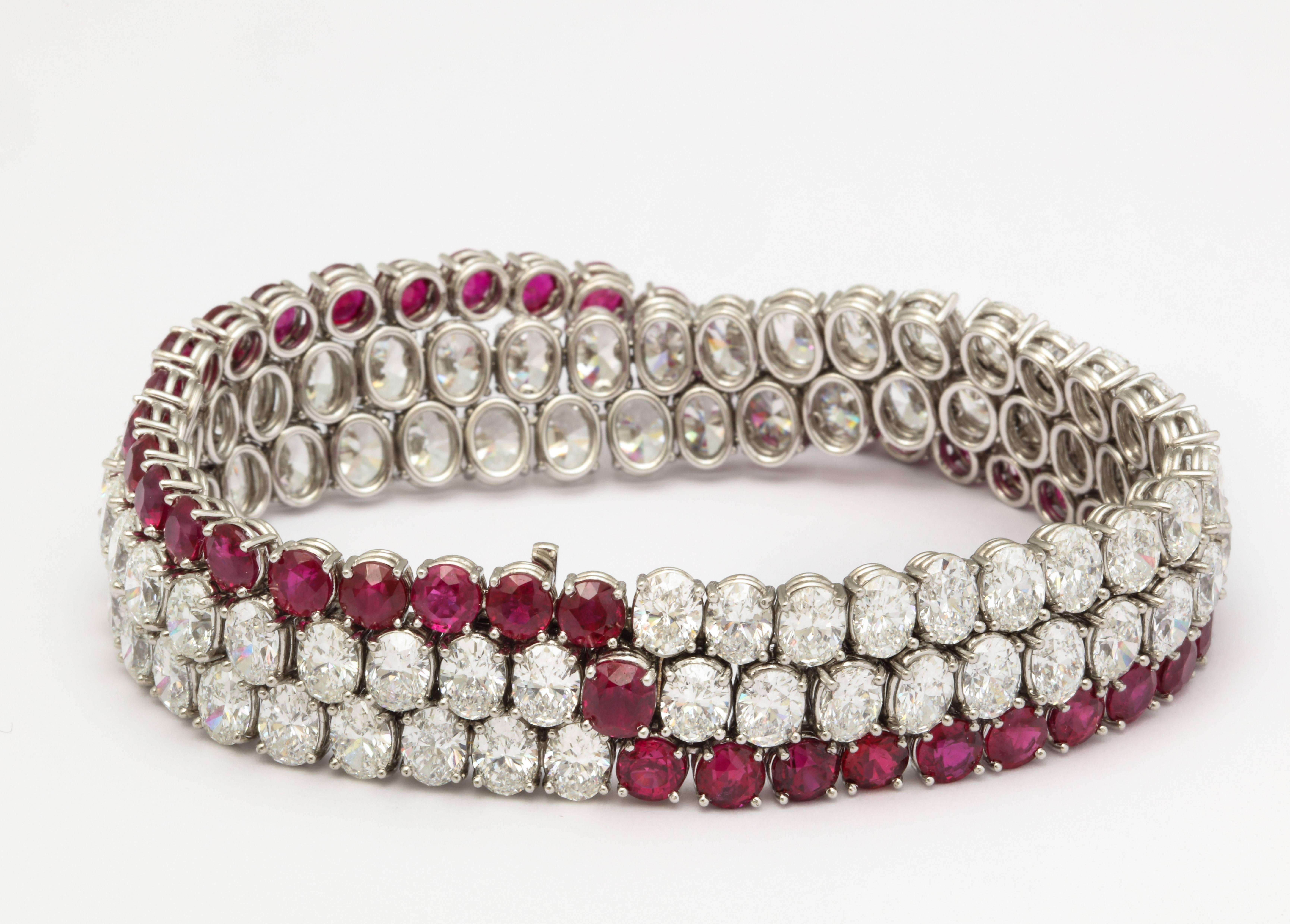 This spectacular bracelet is set with 41 round, natural (no heat treatment) Burmese rubies, weighing a total of 21.59cts and 76 oval diamonds with a total weight of 34.51cts.  The wonderfully supple mounting was expertly crafted in platinum just for