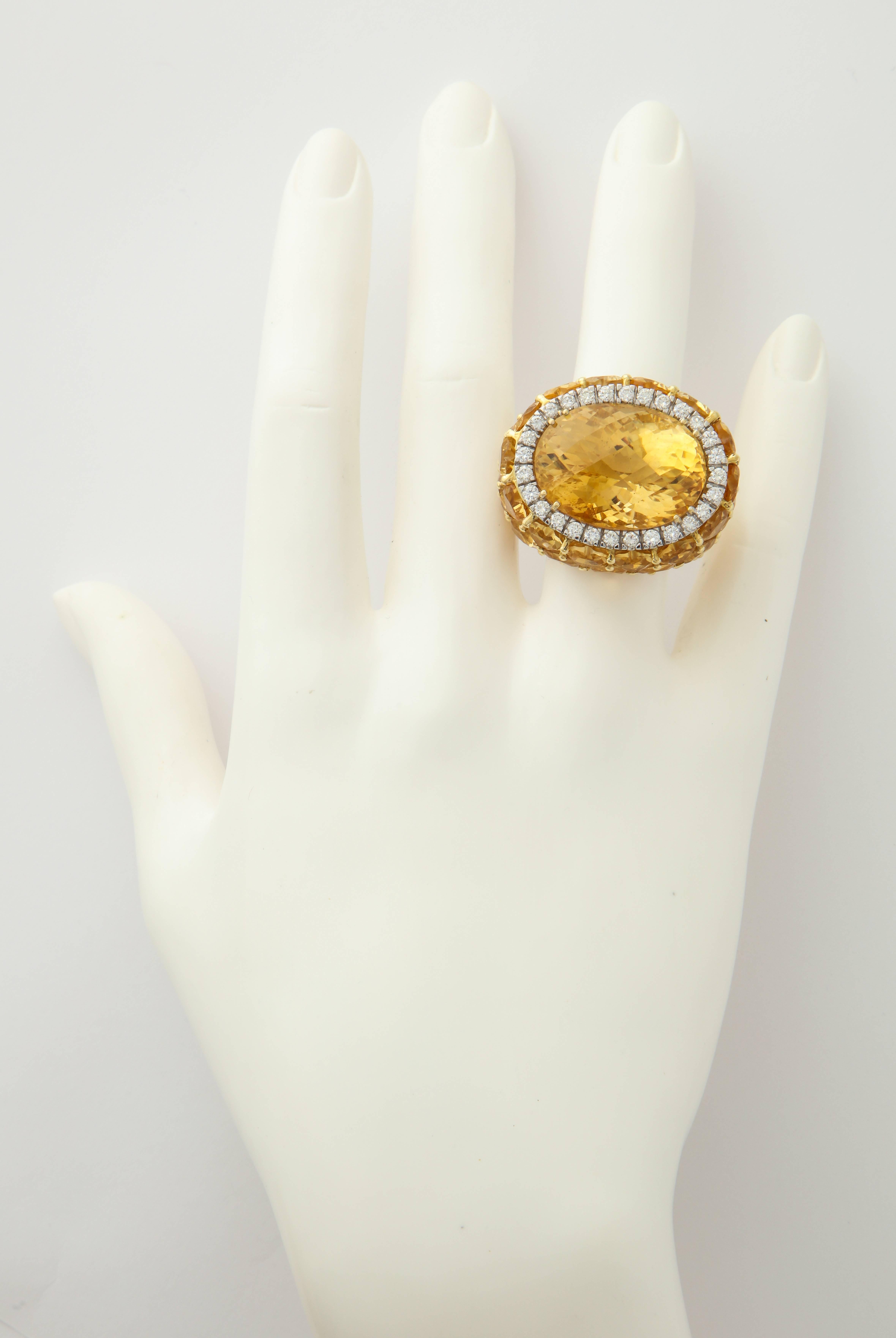 The rich golden citrines and the bright, white diamonds will never fail to be seen in this fantastic cocktail ring.  Bold in it's volume, while precise in the execution, as only the Italians know how to do. 