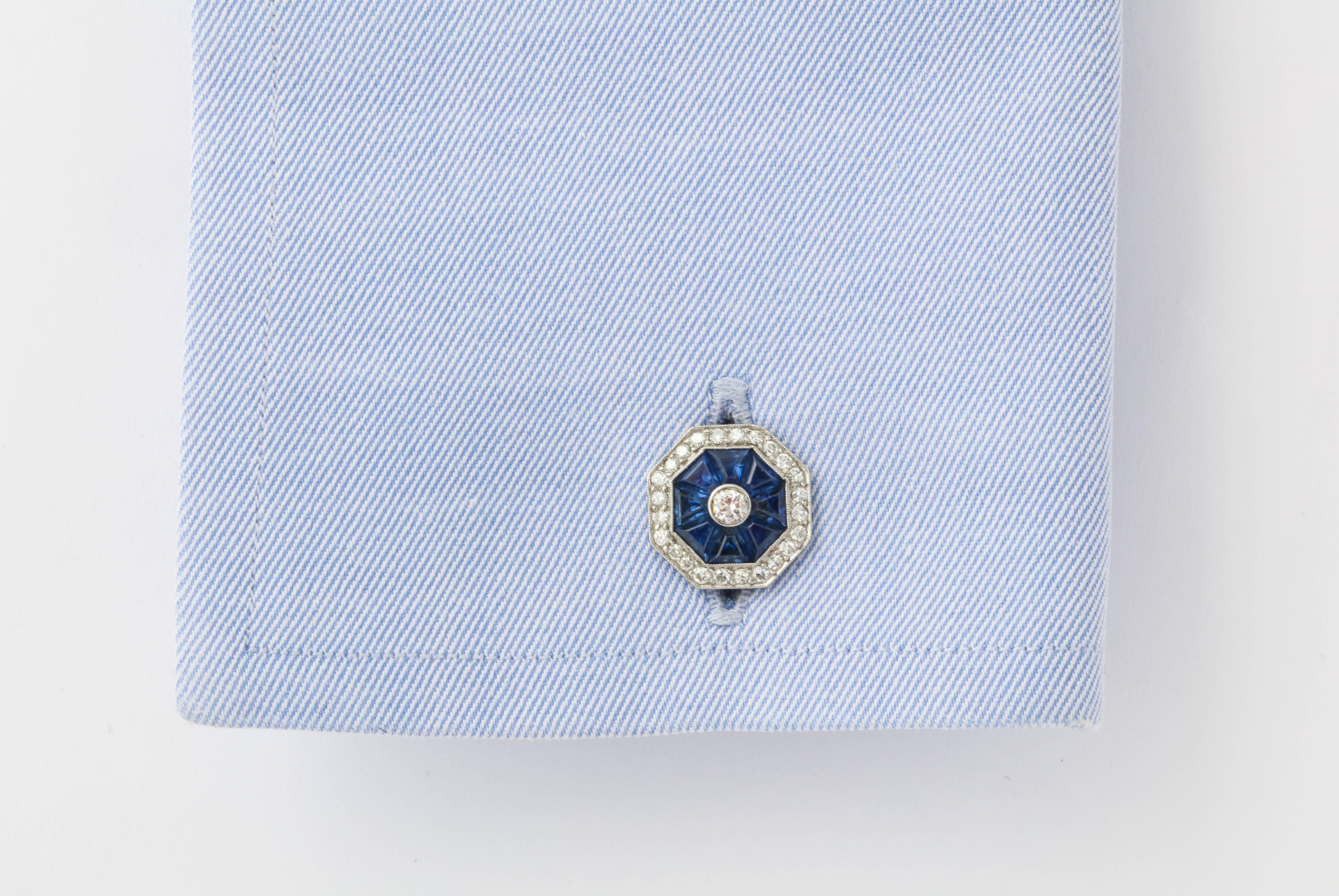 Art Deco cufflinks are always incredibly chic, and a great vintage pair is also very rare.  Perfectly exemplifying the period, these cufflinks feature custom cut blue sapphires which exquisitely surround the center diamond. The outer border of round