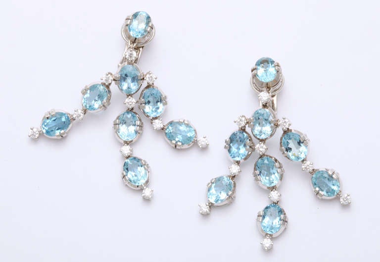 Three rows of beautiful aquamarines (16=21.45cts) are delicately framed with diamonds (20=1.65cts) to complete these stunning chandelier earclips. 

From a family of jewelers dating back to 1927, Michael Kanners is renown as both a creator and a
