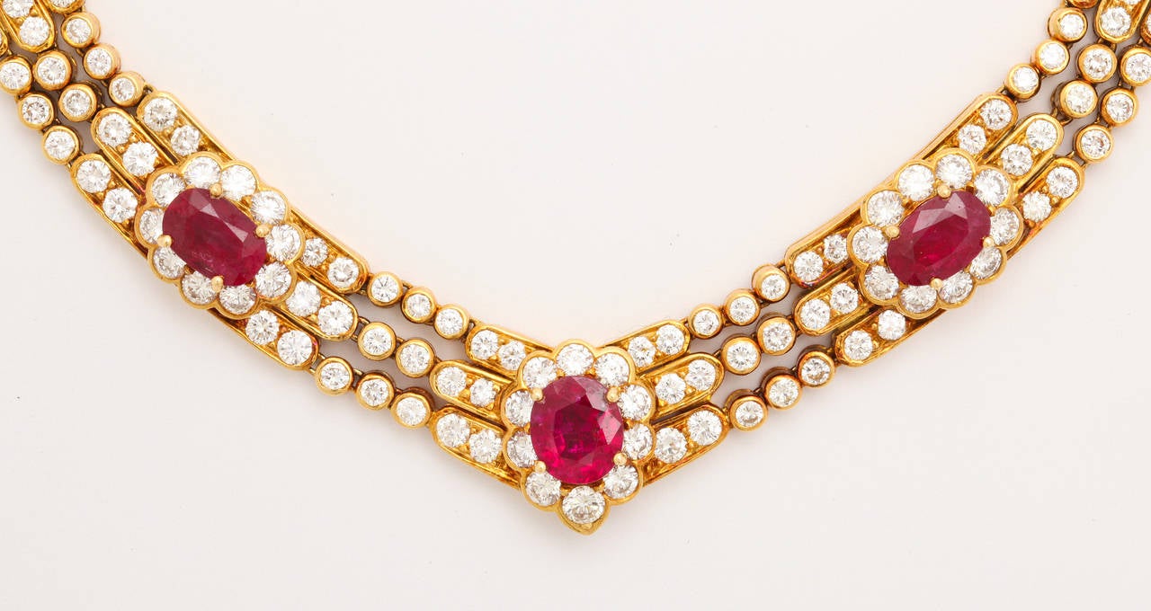 Seven bright red rubies (app. 11cts total weight) are exquisitely set in a wonderfully flexible 18kt yellow gold and diamond (app. 19cts total weight) mounting by the famous jeweler Laurence Graff of London.  A concealed hook to suspend a pendant is