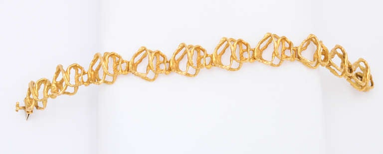 Circa 1970 18kt yellow gold (43.8 grams) bracelet, by Gubelin (Switzerland).  The sculptural style, and texture of this bracelet are truly representative of the time period.  The bracelet will comfortably fit up to a 7 inch wrist.

From a family