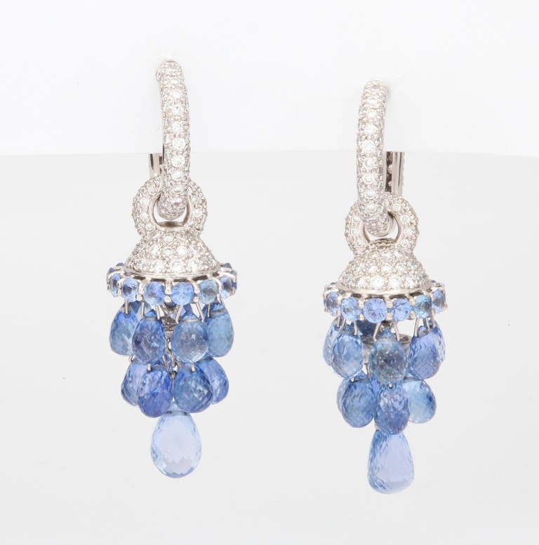 Beautiful, bright sapphire briolettes are hung in a chandelier design from pavé diamond hoops.  A unique design by Golconda, New York, a specialized atelier of fine, handmade jewelry featuring unique colored stones and pearls.

From a family of