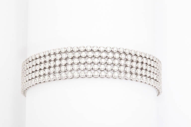 Five rows of scintillating diamonds in a fully, flexible bracelet.  Whether worn casually or elegantly, this bracelet is destined to become a mainstay of anyone's jewelry collection.  Total diamond weight app. 5.50cts.

From a family of jewelers