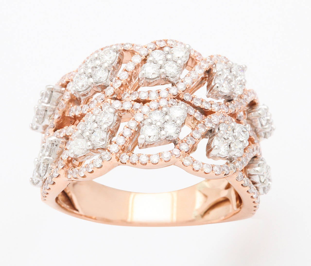 Bold and stylish 18kt rose gold and white diamond ring, set with app. 1 1/2 carats of fine, white diamonds.  Size 6.

From a family of jewelers dating back to 1927, Michael Kanners is renown as both a creator and a purveyor of rare and unique