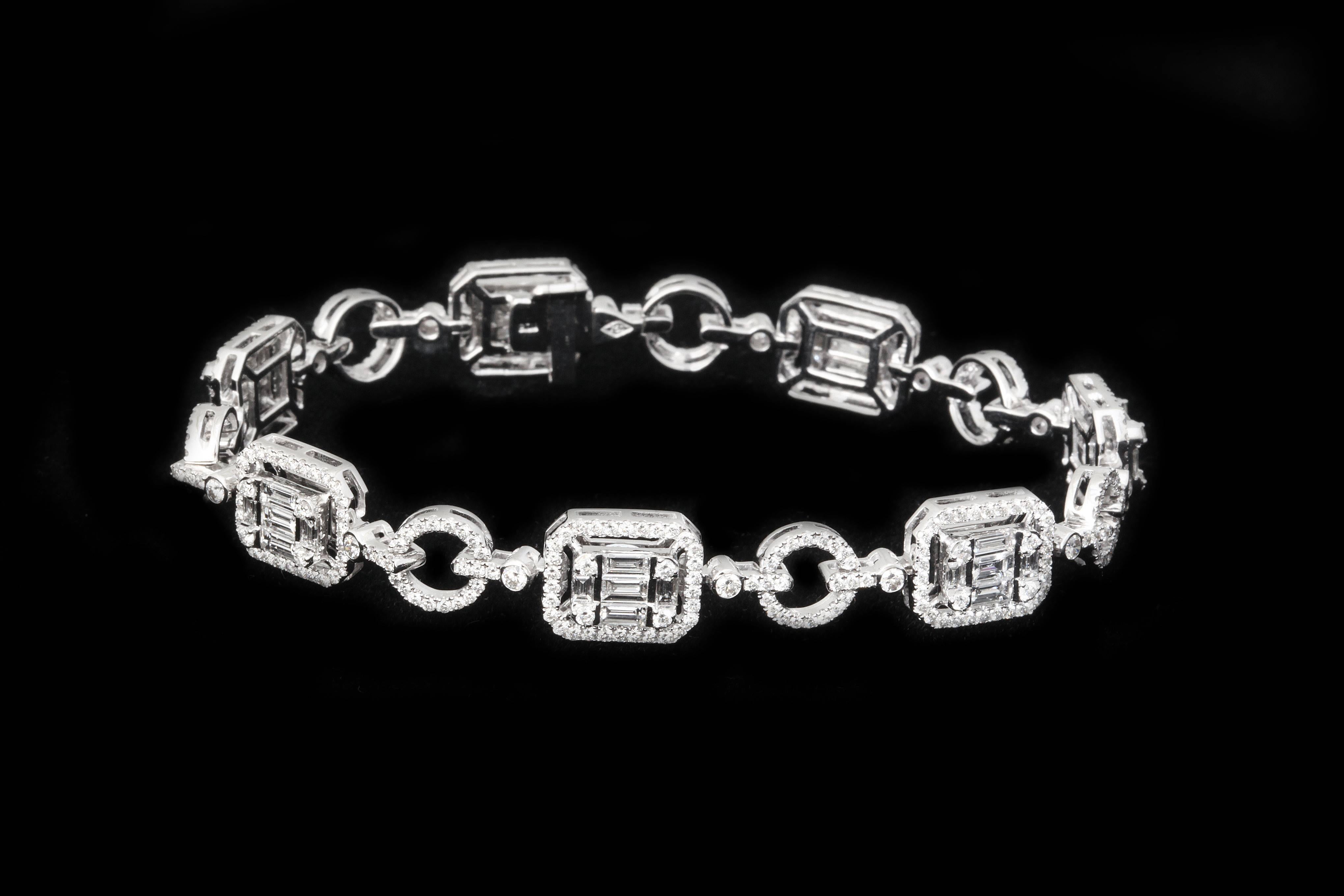 A stylish mixture of baguette and round diamonds. The stones are finely matched, and expertly set in emerald cut and circular configurations.  Flexible and bold; comfortable and impressive.  Total diamond weight app. 5cts.
