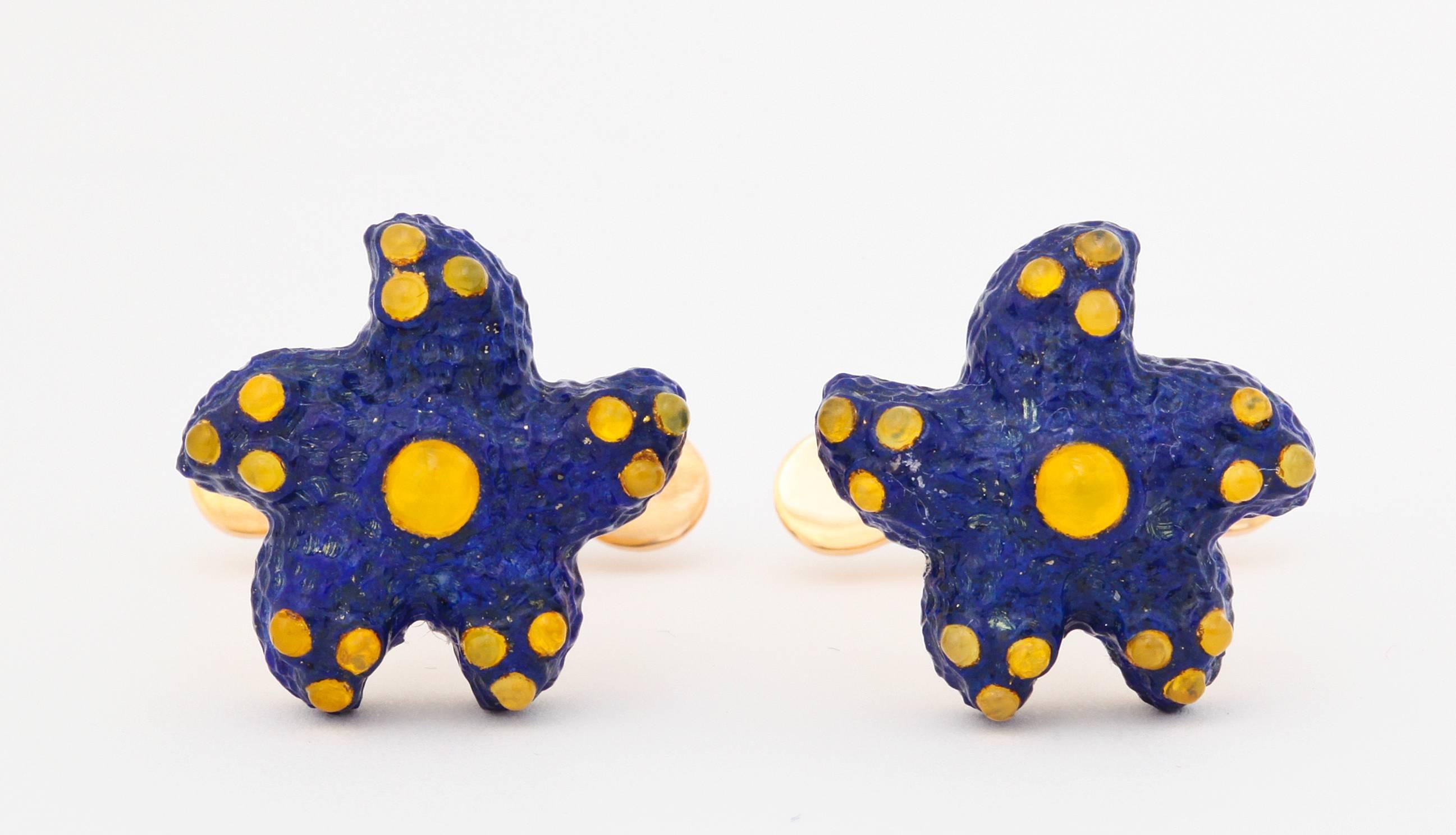 The finest cobalt blue lapis-lazuli is expertly carved in the form of a sea star and delicately set with spheres of yellow agate.  A matching lapis cabochon is set into the spring back to complete these elegant cufflinks.  This design is always one