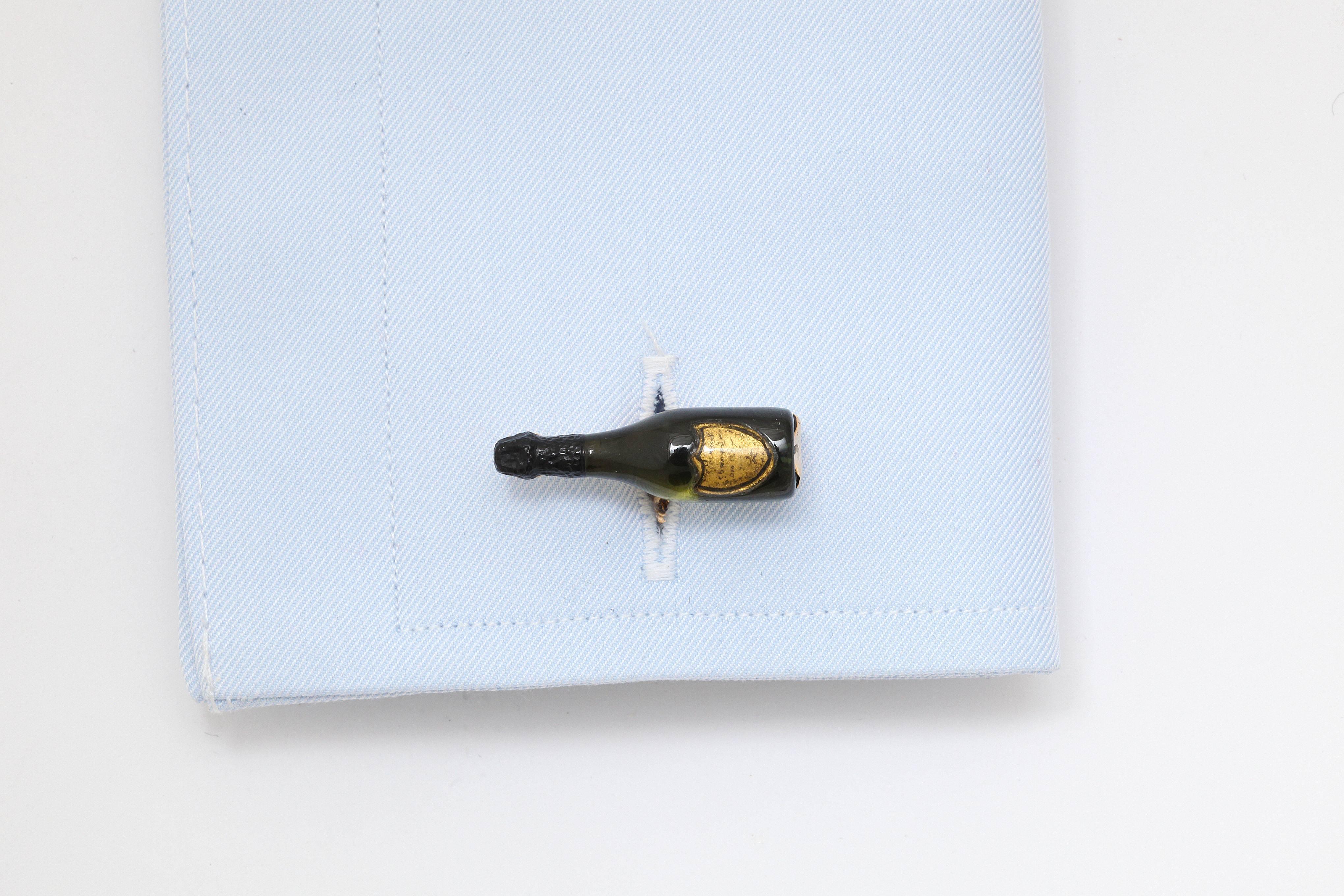 These are truly the most unique champagne bottle cufflinks around.  The body of the bottle is expertly shaped from green tourmaline by a master stone carver.  The top of the bottle, which is traditionally covered in black foil, is carved from black