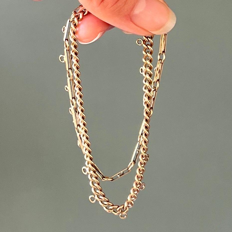 A 14 karat yellow gold double layer chain and link charm bracelet. The bracelets are suitable as a charm bracelets, on which charms with a beautiful memory can be worn. The bracelet is a timeless must-have and can be perfectly combined with all your