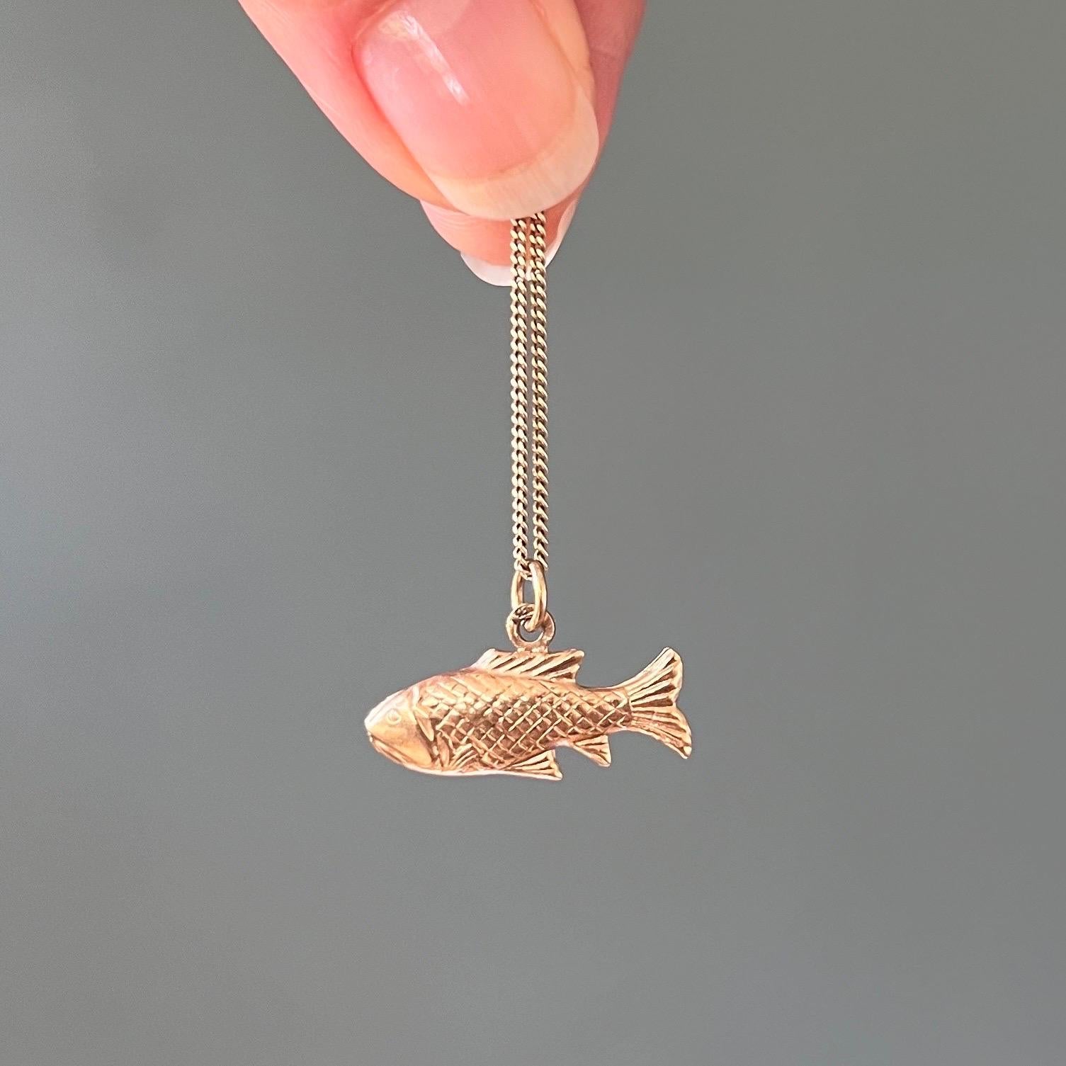 This 14 karat gold fish pisces zodiac charm is beautifully detailed with scales and fins. The fish symbol is associated with wisdom, creativity and fertility. The charm is great worn alone on a necklace chain or as an addition to your charms
