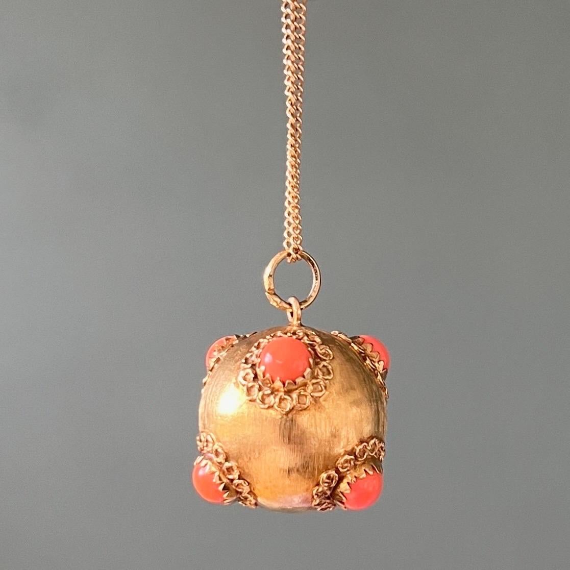 A beautiful large and heavy 18 karat gold Venetian Etruscan fob charm pendant in the shape of a ball or also called sputnik. This Italian charm is set with six precious cabochon cut coral stones, while the gold surface is decorated with filigree,