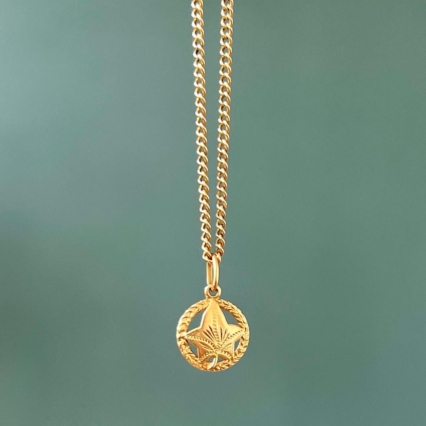 An Italian maple leaf 18 karat gold charm pendant. This maple leaf charm has a beautiful design with the typical leaf in the middle and surrounded by a wreath. Charms are great to collect as wearable memories, it has a symbolic and often a