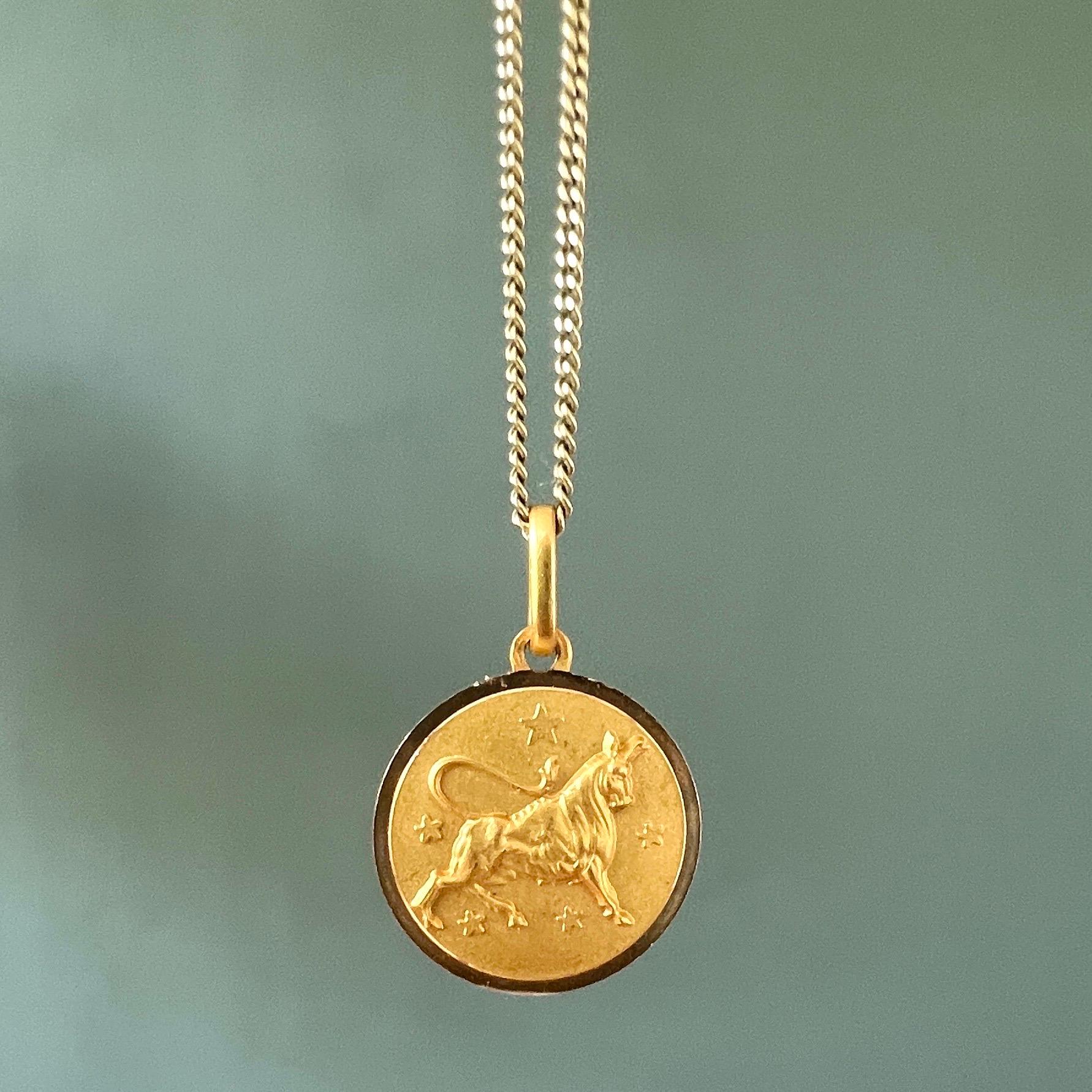 An 18 karat gold zodiac taurus charm pendant. The taurus or bull charm is beautifully designed in relief with stars and created in 18 karat gold. 

Charms are great to collect as wearable memories, it has a symbolic and often a sentimental value.