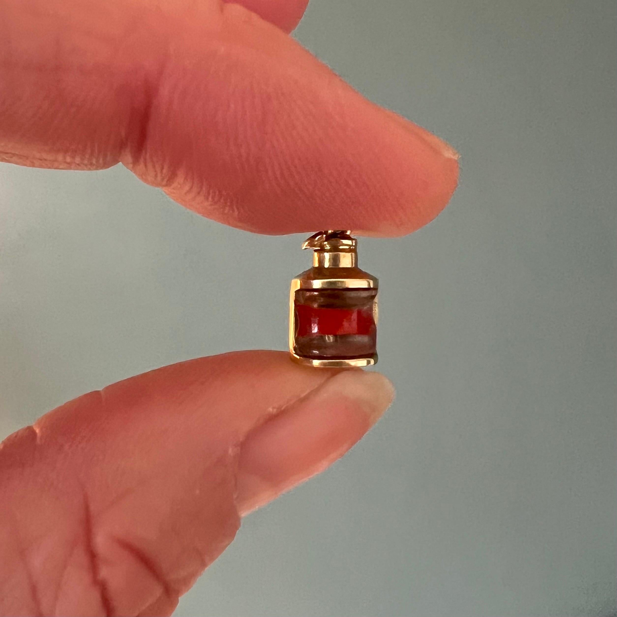 A lovely small vintage 14 karat gold lantern charm pendant. The cute lantern is beautifully detailed and is set with glass and a red stripe in the center which indicates the lit fuse of the lantern.

Collect your own charms as wearable memories, it