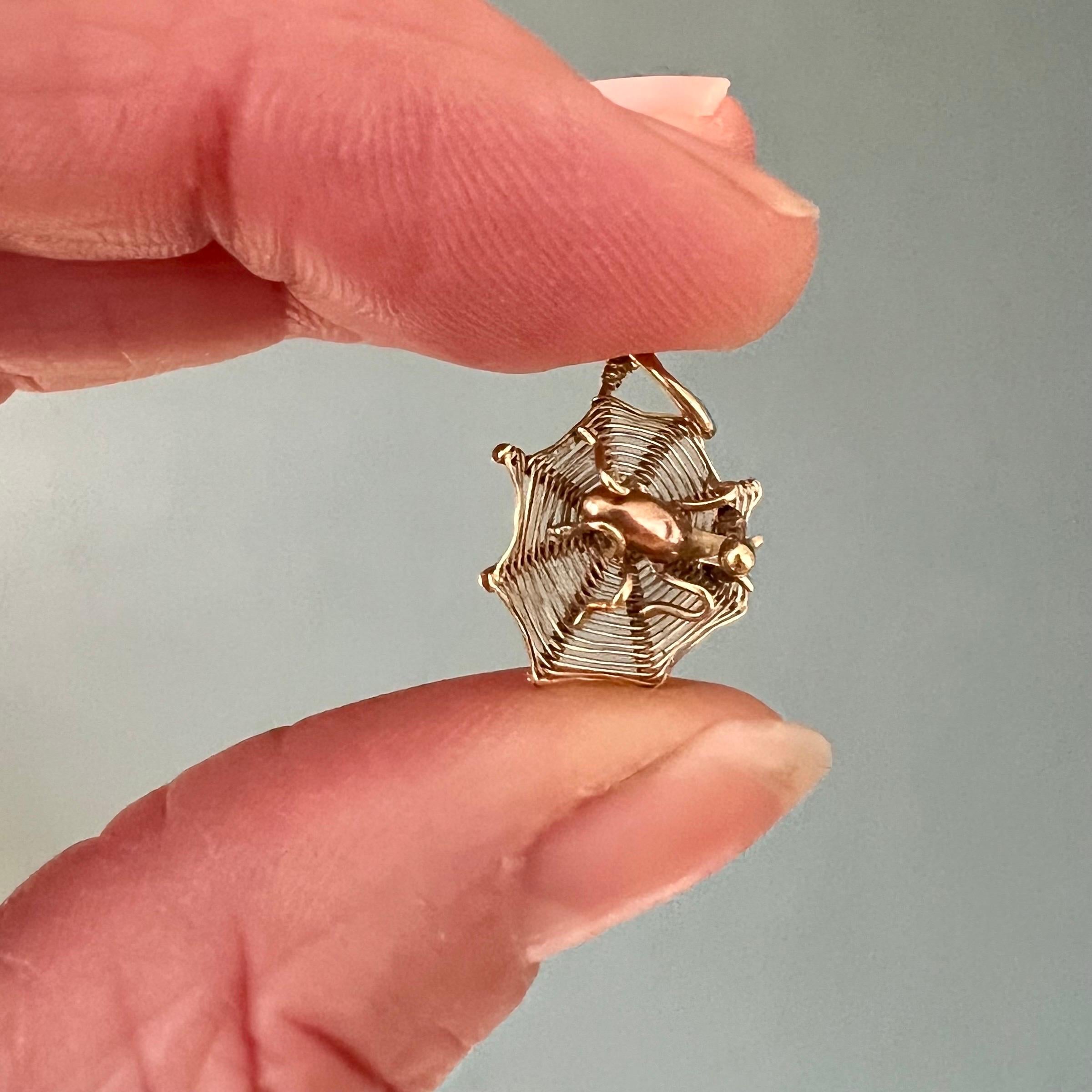 This is a 14 karat gold vintage spider web charm. This adorable spider web charm is beautifully made with a rose gold spider in the center spinning its web to catch delicious insect meals.

Charms are great to collect as wearable memories, it has a