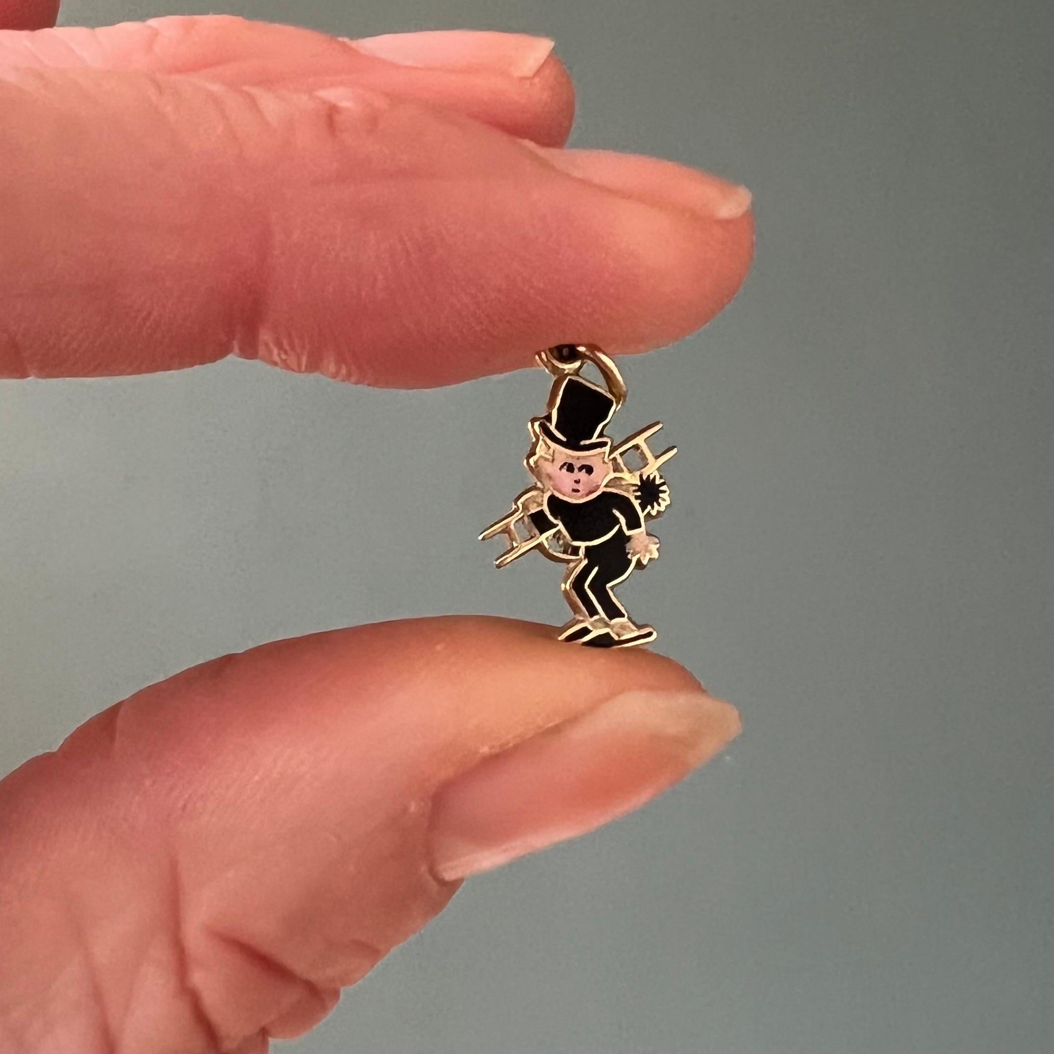 This is a 14 karat gold vintage enamel charm pendant crafted in the shape of a chimney sweeper. This cute little chimney sweeper is nicely detailed with black and white enamel throughout his body.

Charms are great to collect as wearable memories,