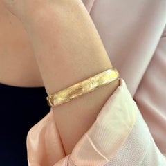 Bracelet jonc vintage gravé de fleurs en or 14 carats