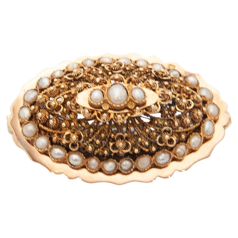 Ancienne broche, en métal doré et perles, Amerikaner
